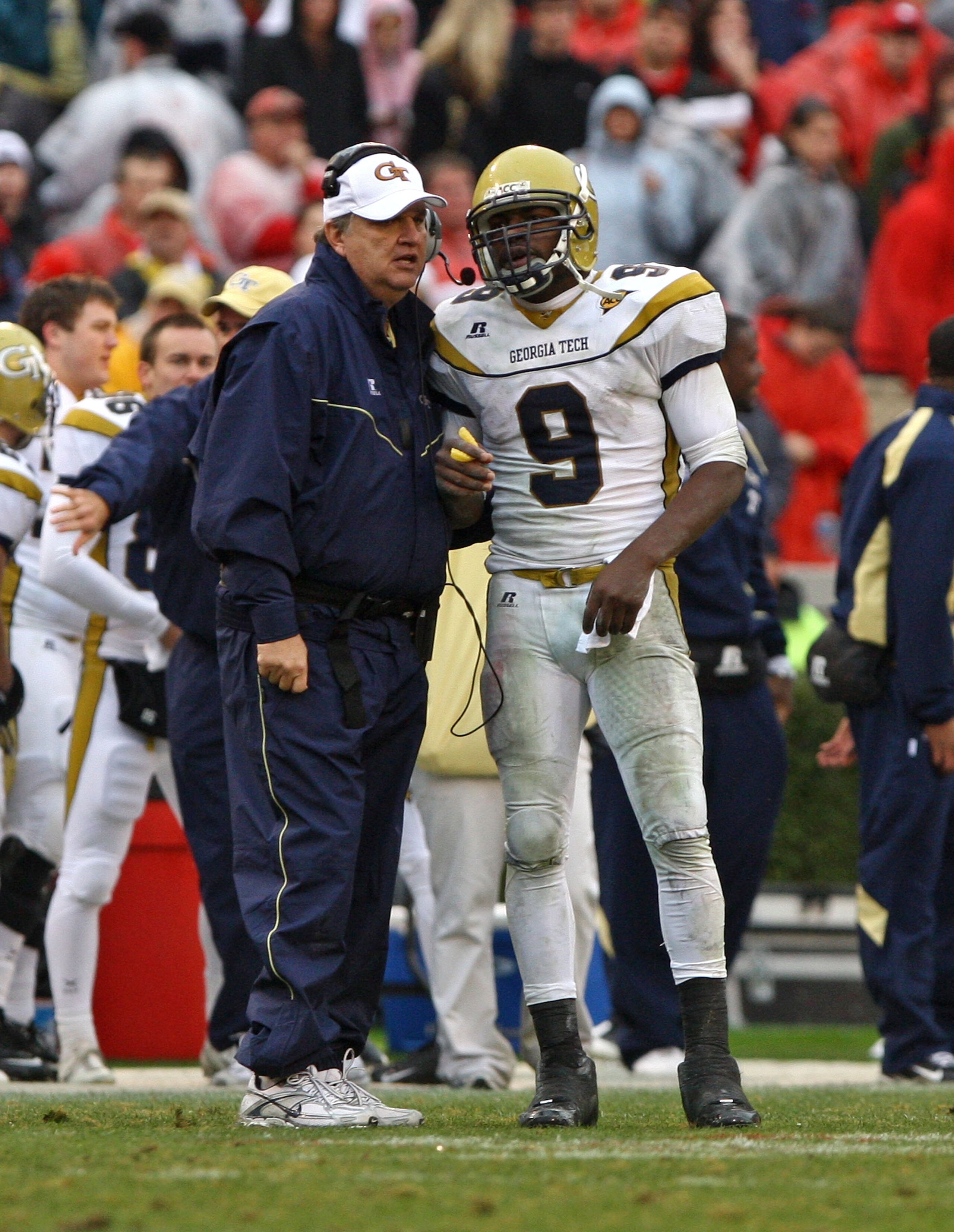ATHENS, GA - NOVEMBER 29:  Head coach Paul Johnson and quarterback Josh Nesbitt #9 of the Georgia Tech Yellow Jackets share a discussion during a timeout in the game against the Georgia Bulldogs at Sanford Stadium on November 29, 2008 in Athens, Georgia.