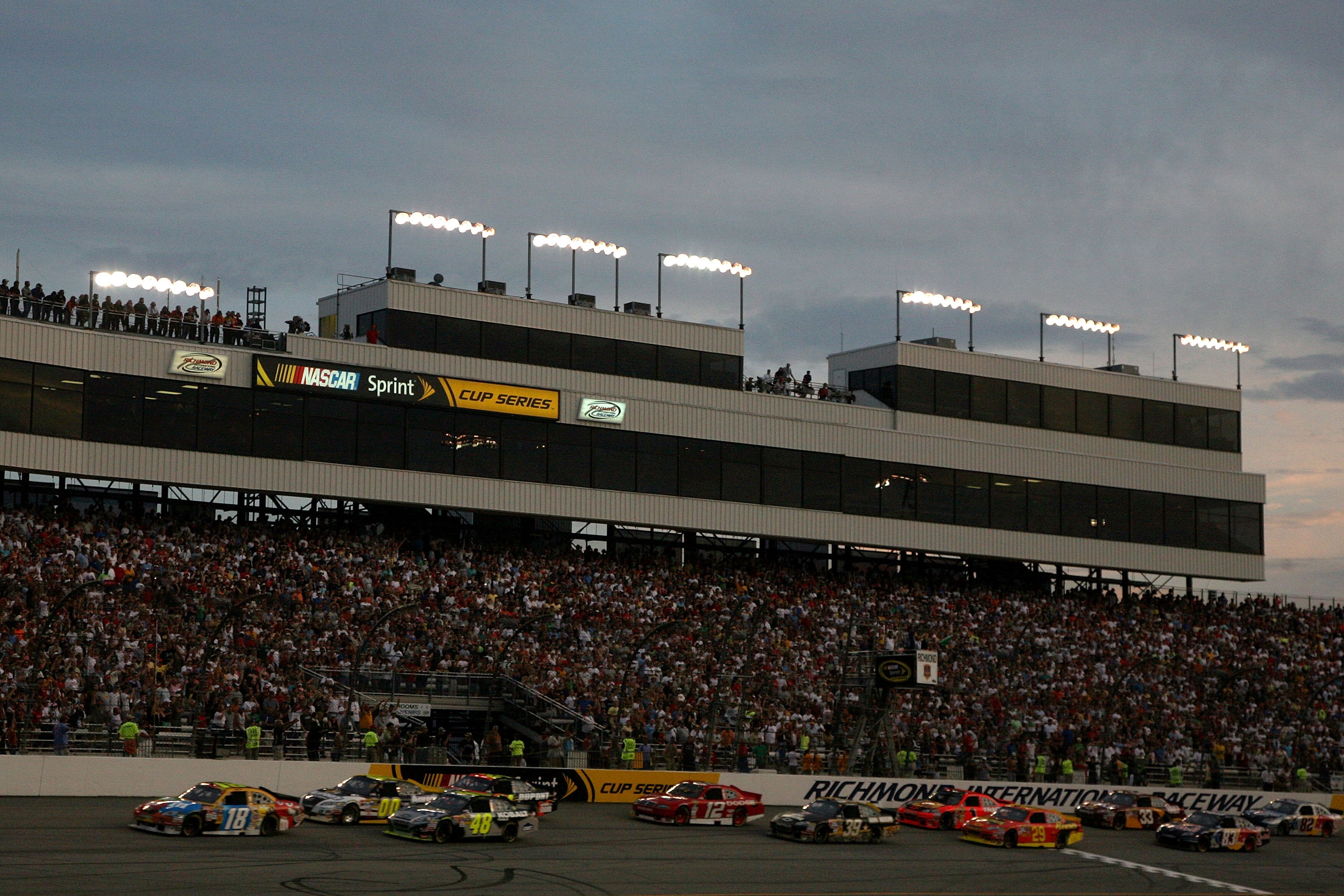 RICHMOND, VA - MAY 01:  Kyle Busch, driver of the #18 M&M's Toyota, leads the field at the start of the NASCAR Sprint Cup Series Crown Royal Presents the Heath Calhoun 400 at Richmond International Raceway on May 1, 2010, 2010 in Richmond, Virginia.  (Pho
