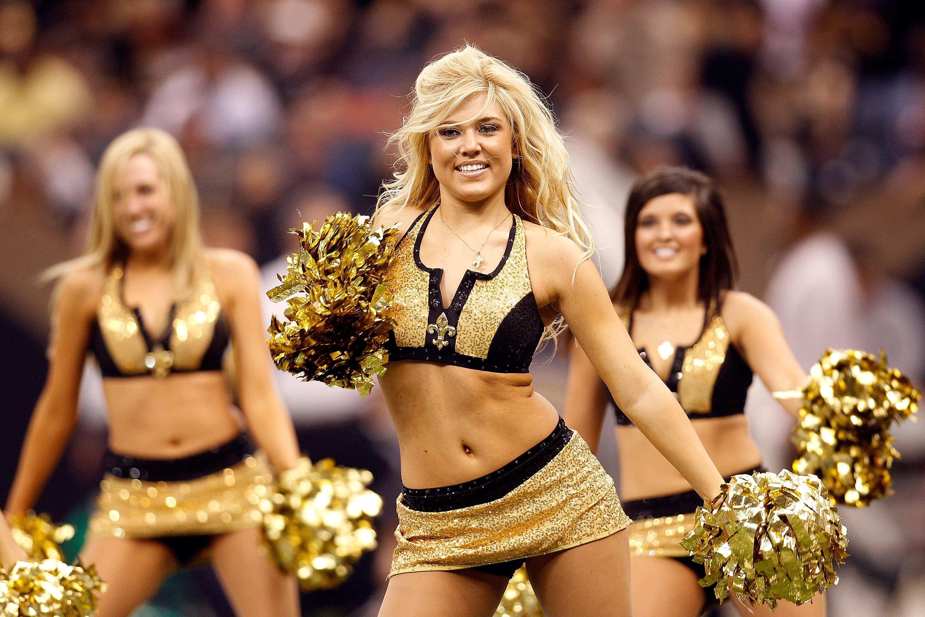 NEW ORLEANS - JANUARY 24:  Cheerleaders for the New Orleans Saints perform against the Minnesota Vikings during the NFC Championship Game at the Louisana Superdome on January 24, 2010 in New Orleans, Louisiana. The Saints won 31-28 in overtime. (Photo by