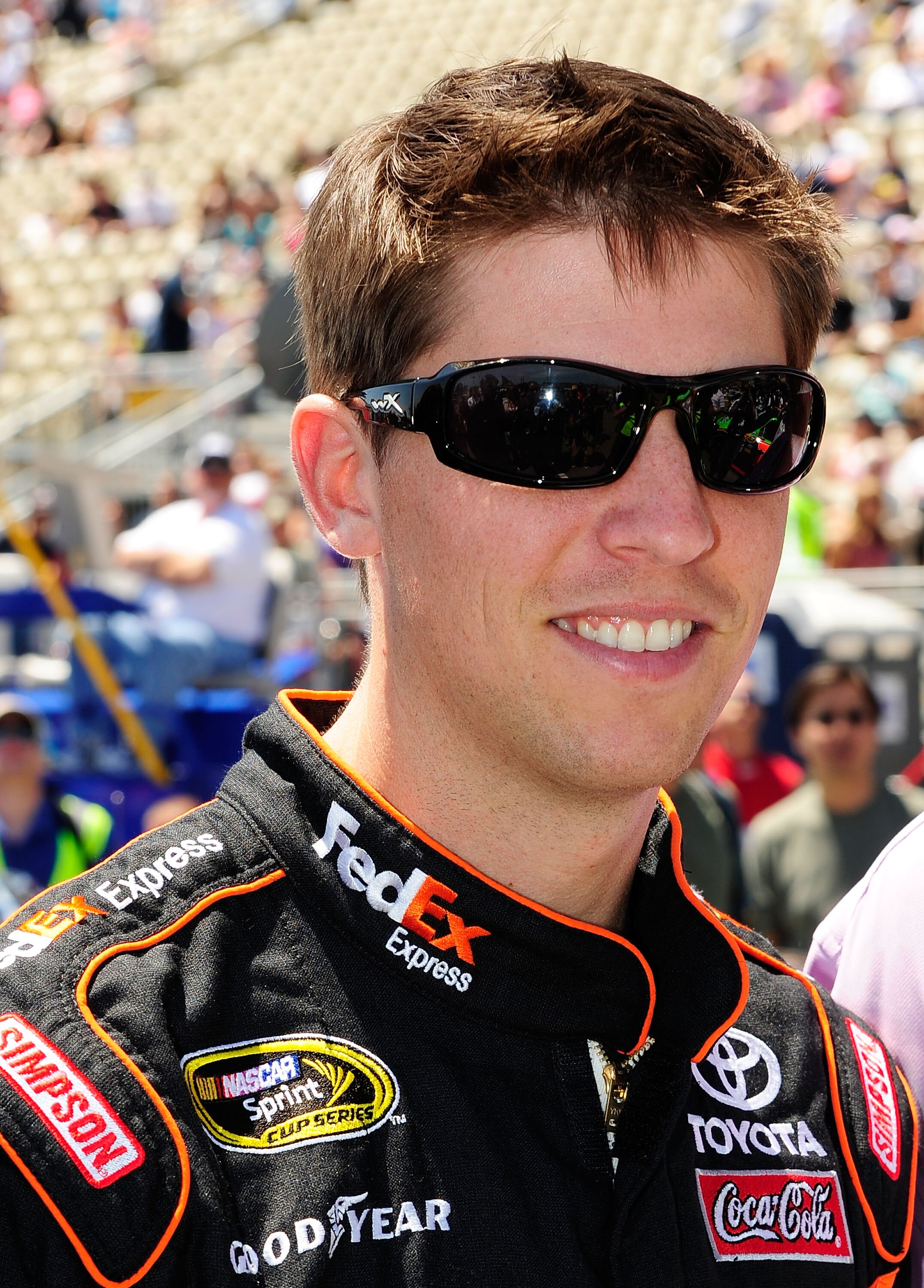 SONOMA, CA - JUNE 20:  Denny Hamlin, driver of the #11 FedEx Toyota looks on prior to the start of the NASCAR Sprint Cup Series Toyota/Save Mart 350 at Infineon Raceway on June 20, 2010 in Sonoma, California.  (Photo by Rusty Jarrett/Getty Images for NASC