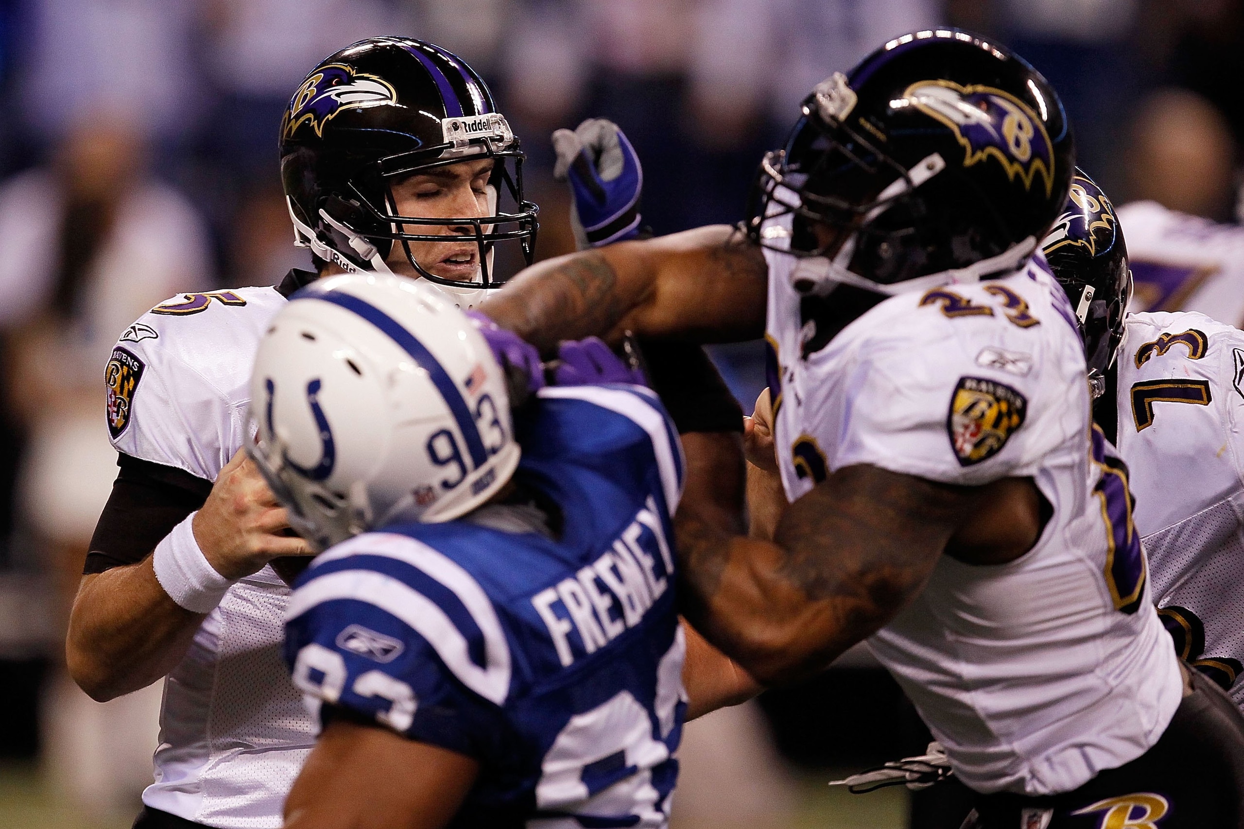 INDIANAPOLIS - JANUARY 16:  Quarterback Joe Flacco #5 of the Baltimore Ravens is rushed by Dwight Freeney #93 of the Indianapolis Colts in the AFC Divisional Playoff Game at Lucas Oli Stadium on January 16, 2010 in Indianapolis, Indiana.  (Photo by Jonath