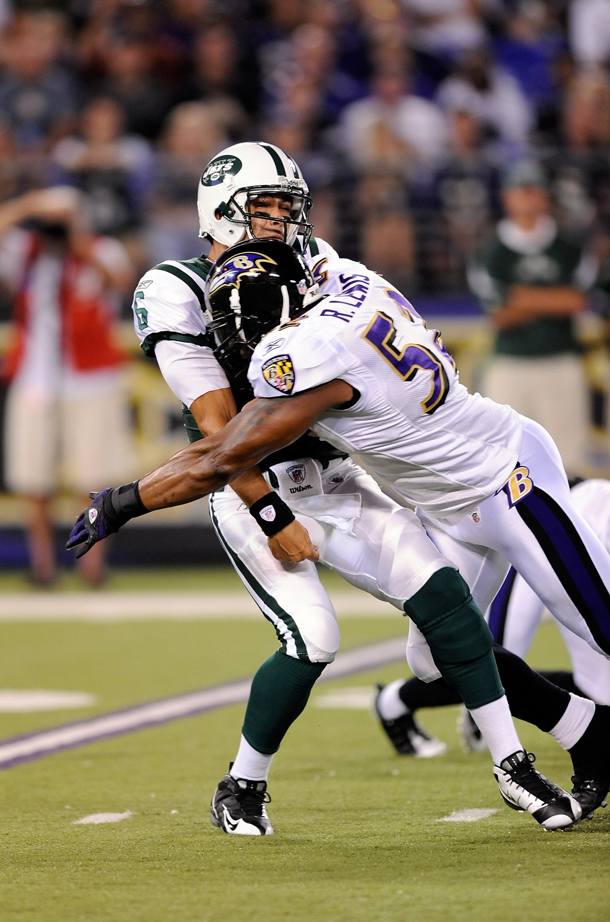 BALTIMORE - AUGUST 24:  Mark Sanchez #6 of the New York Jets is hit by Ray Lewis #52 of the Baltimore Ravens in a preseason game at M&T Bank Stadium on August 24, 2009 in Baltimore, Maryland.  Sanchez's pass was intercepted and returned for a touchdown on
