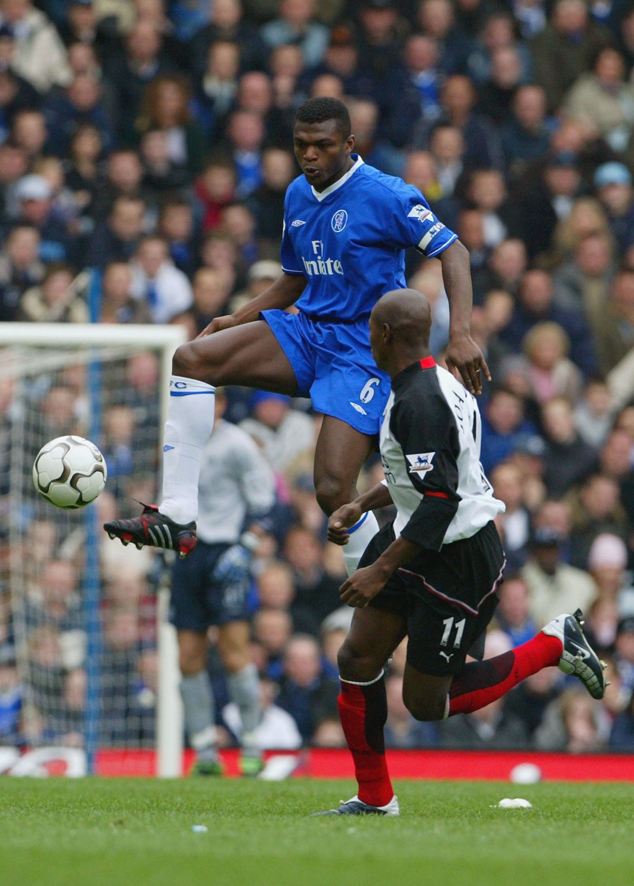 LONDON - MARCH 20:  Marcel Desailly of Chelsea wins the ball from Louis Boa Morte of Fulham during the FA Barclaycard Premiership match between Chelsea and Fulham at Stamford Bridge on March 20, 2004 in London.  (Photo by Phil Cole/Getty Images)