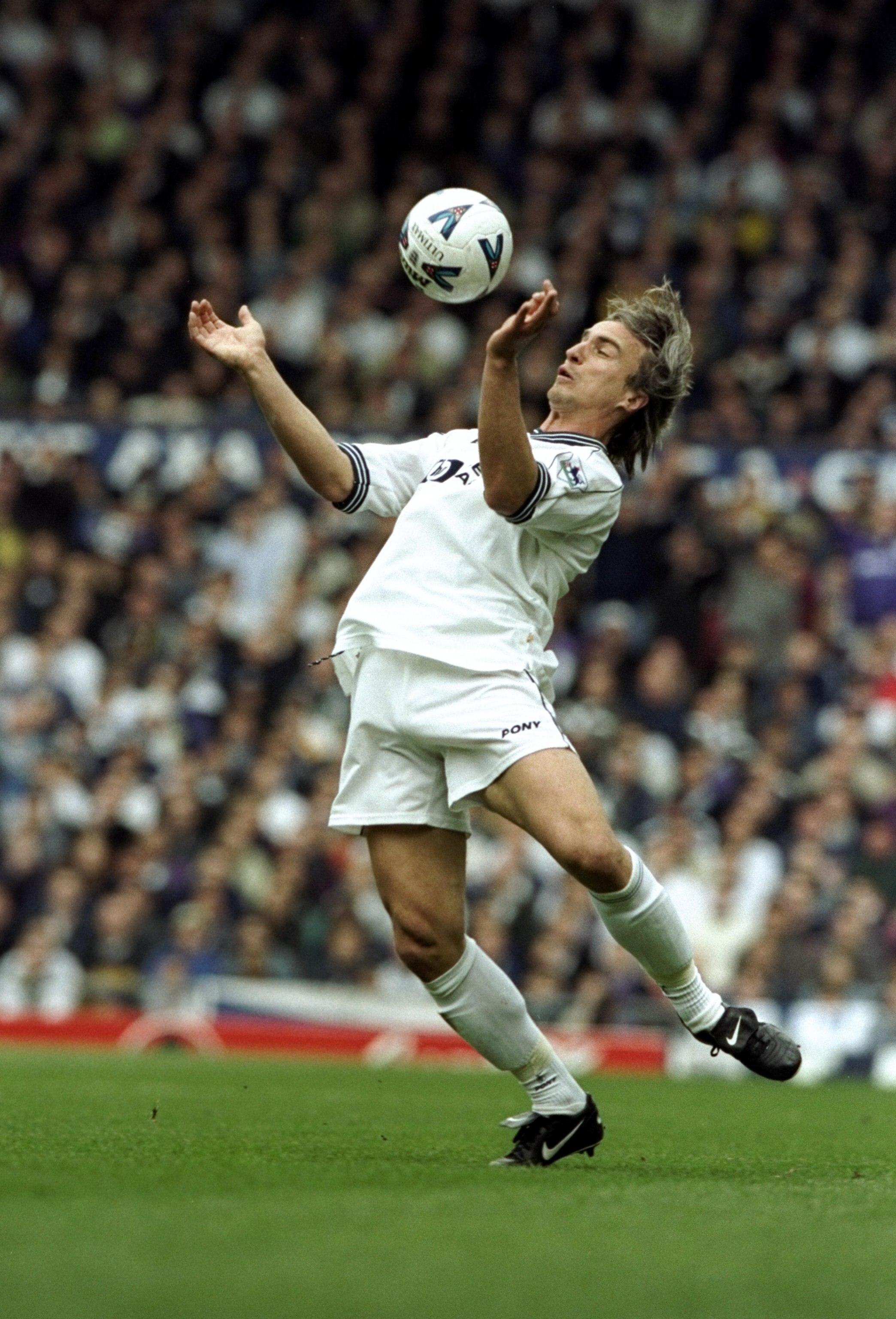 11 Apr 1999:  David Ginola of Newcastle United chests the ball in the FA Cup semi-final against Tottenham Hotspur at Old Trafford in Manchester, England. Newcastle won 2-0 after extra-time.  \ Mandatory Credit: Stu Forster /Allsport