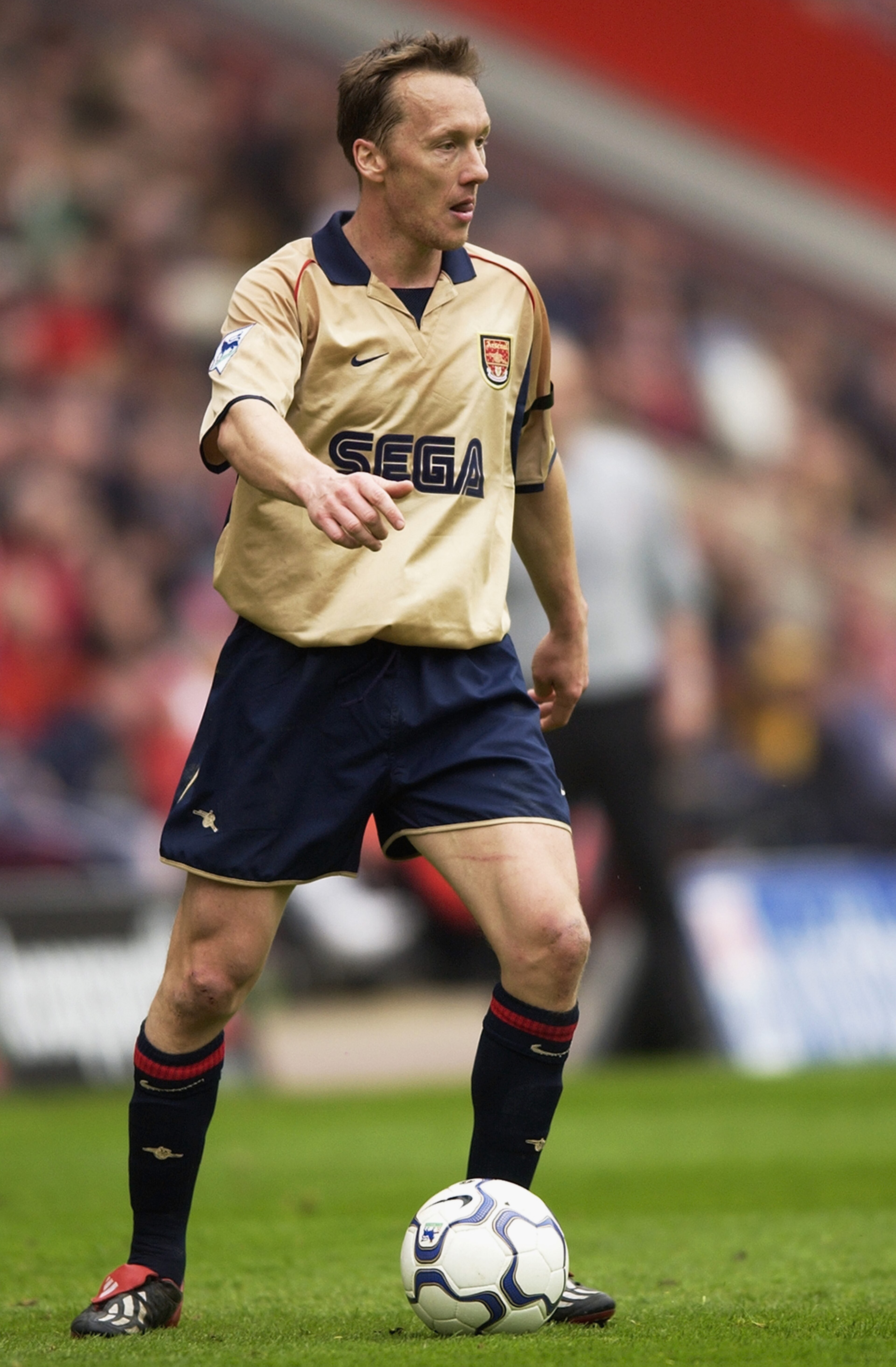 1 Apr 2002:  Lee Dixon of Arsenal runs with the ball during the FA Barclaycard Premiership match between Charlton Athletic and Arsenal played at The Valley, in London. Arsenal won the match 3-0. DIGITAL IMAGE. \ Mandatory Credit: Jamie McDonald/Getty Imag