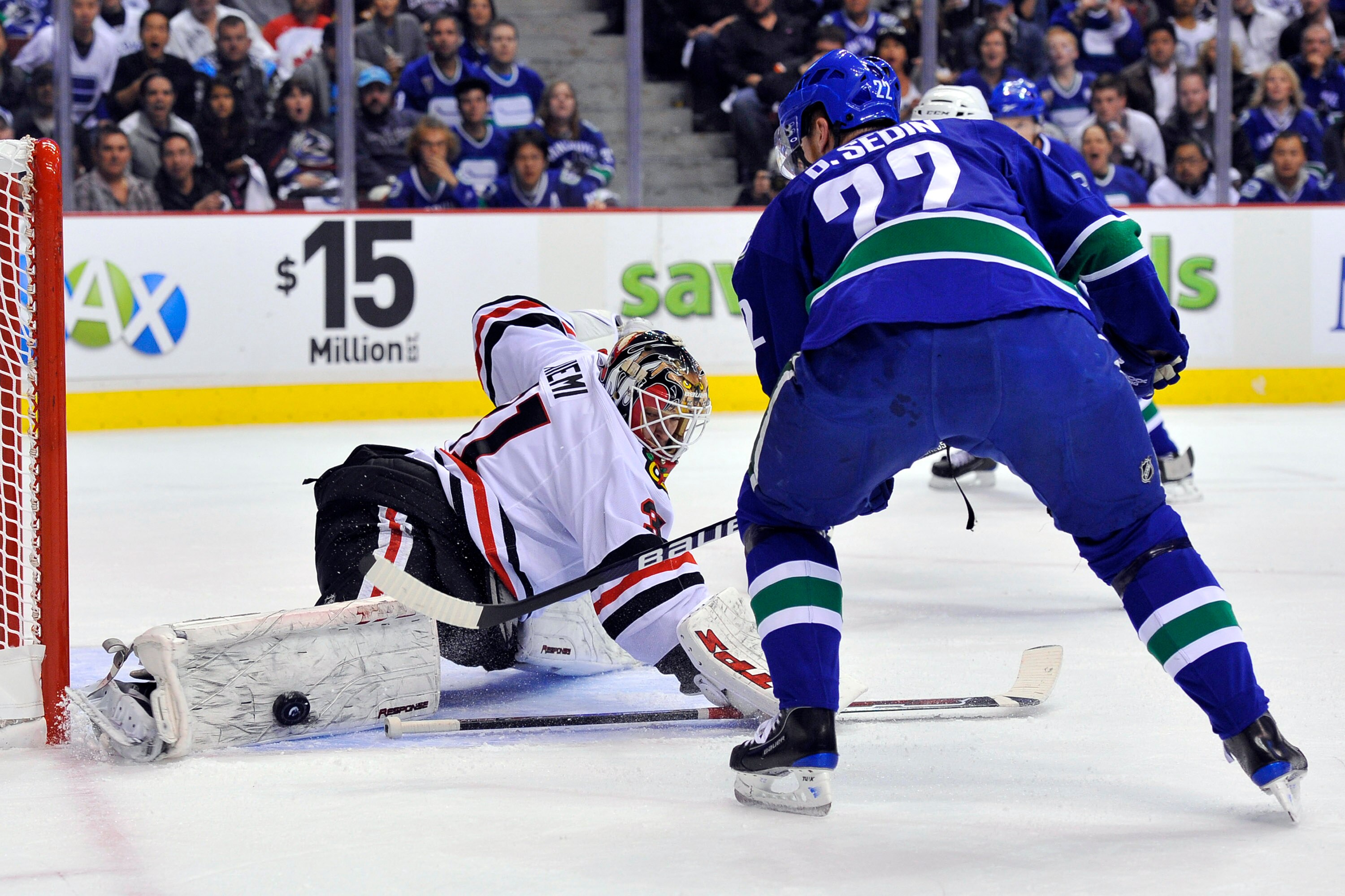 VANCOUVER, CANADA - MAY 5:  Goalie Antti Niemi #31 of the Chicago Blackhawks stops Daniel Sedin #22 of the Vancouver Canucks in close during the first period in Game Three of the Western Conference Semifinals during the 2010 NHL Stanley Cup Playoffs on Ma