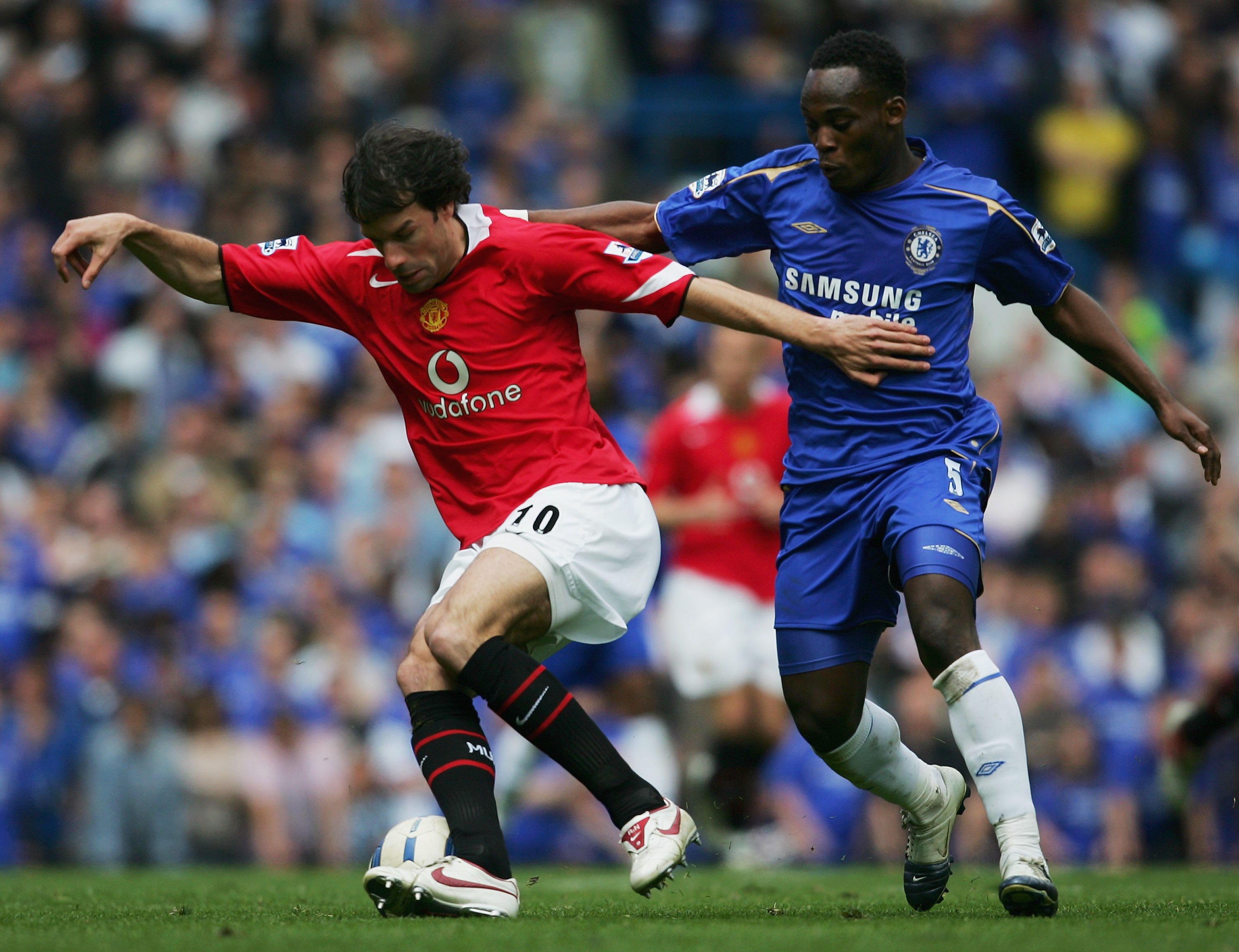 LONDON - APRIL 29:  (L-R) Ruud Van Nistelrooy of Manchester United is challenged by Michael Essien of Chelsea for the ball during the Barclays Premiership match between Chelsea and Manchester United at Stamford Bridge on April 29, 2006 in London, England.