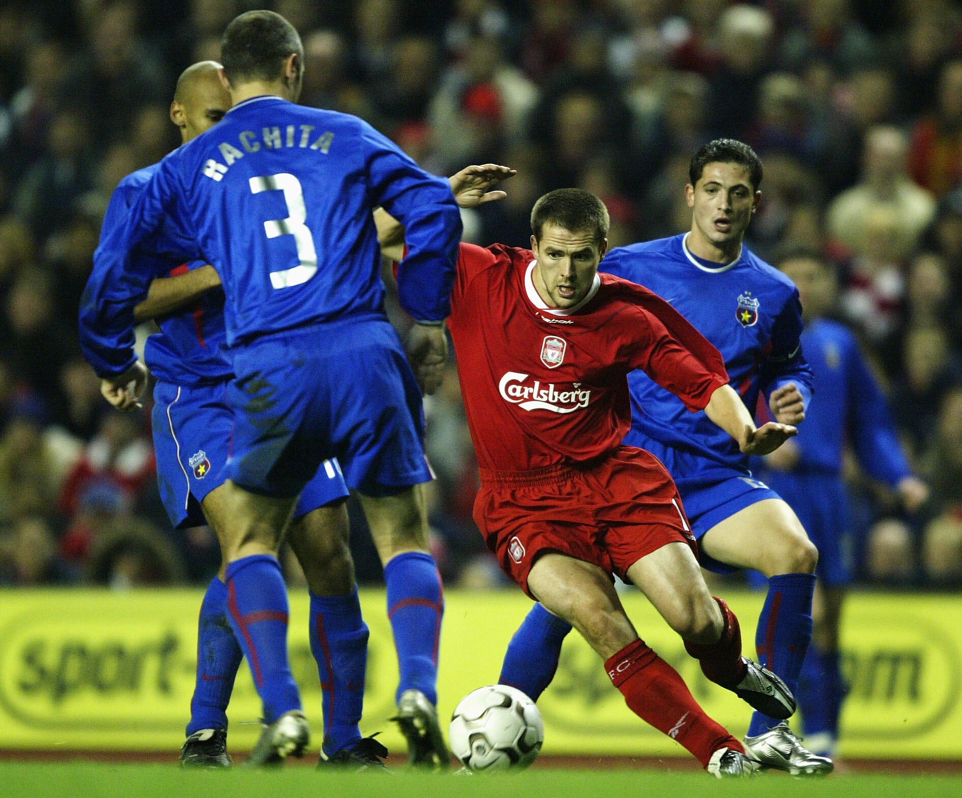 LIVERPOOL, ENGLAND - NOVEMBER 27:  Michael Owen of Liverpool gets past Valeriu Rachita of Steaua during the UEFA Cup second round, second leg match between liverpool and Steaua Bucharest at Anfield on November 27, 2003 in Liverpool, England. (Photo by Cli