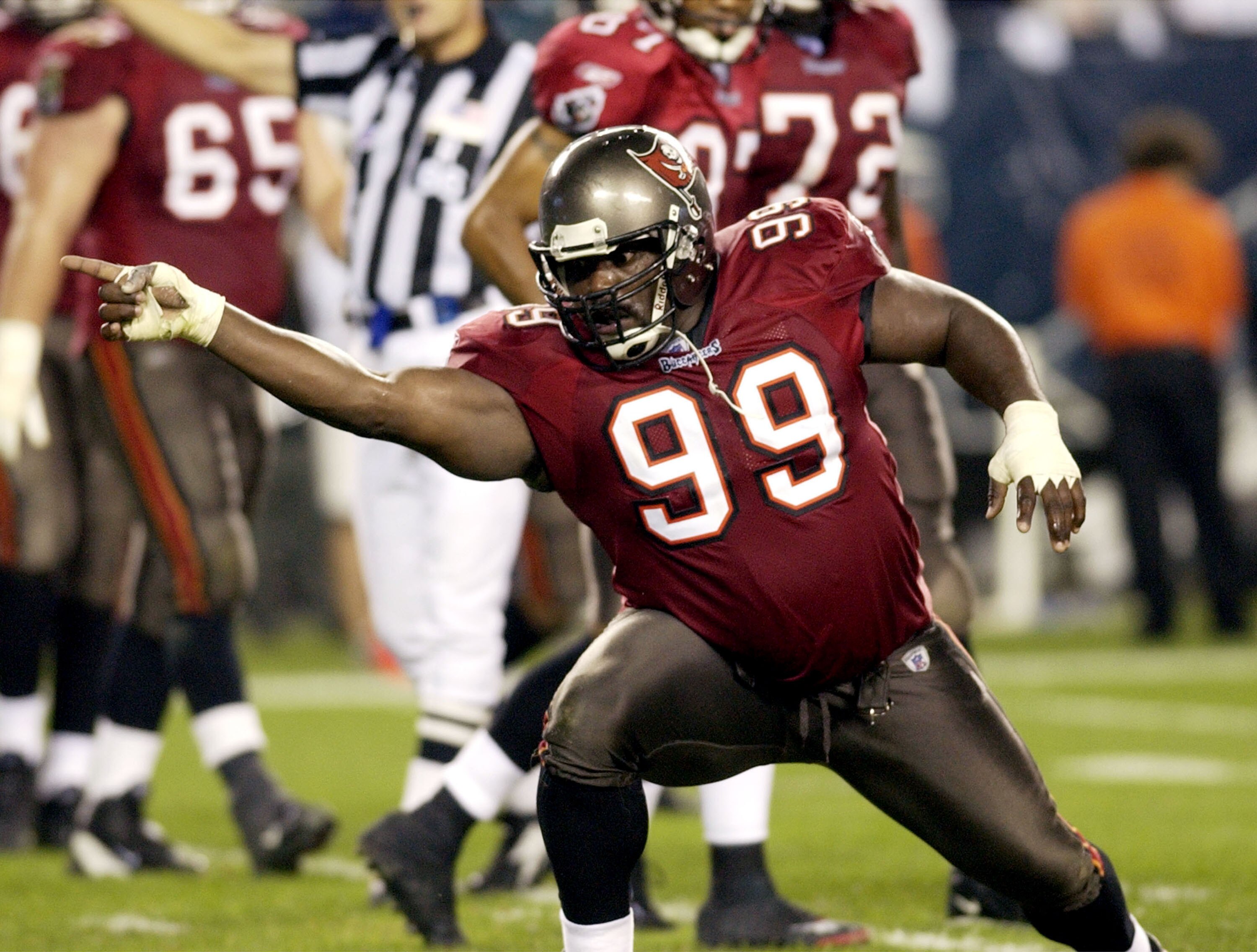 Tampa Bay Buccaneers defensive end Warren Sapp points to the end zone after he grabs a pass as an eligible receiver on September 8, 2003 at Lincoln Financial Field in Philadelphia.  The Buccaneers defeated the Eagles 17 - 0 to open the season on Monday Ni