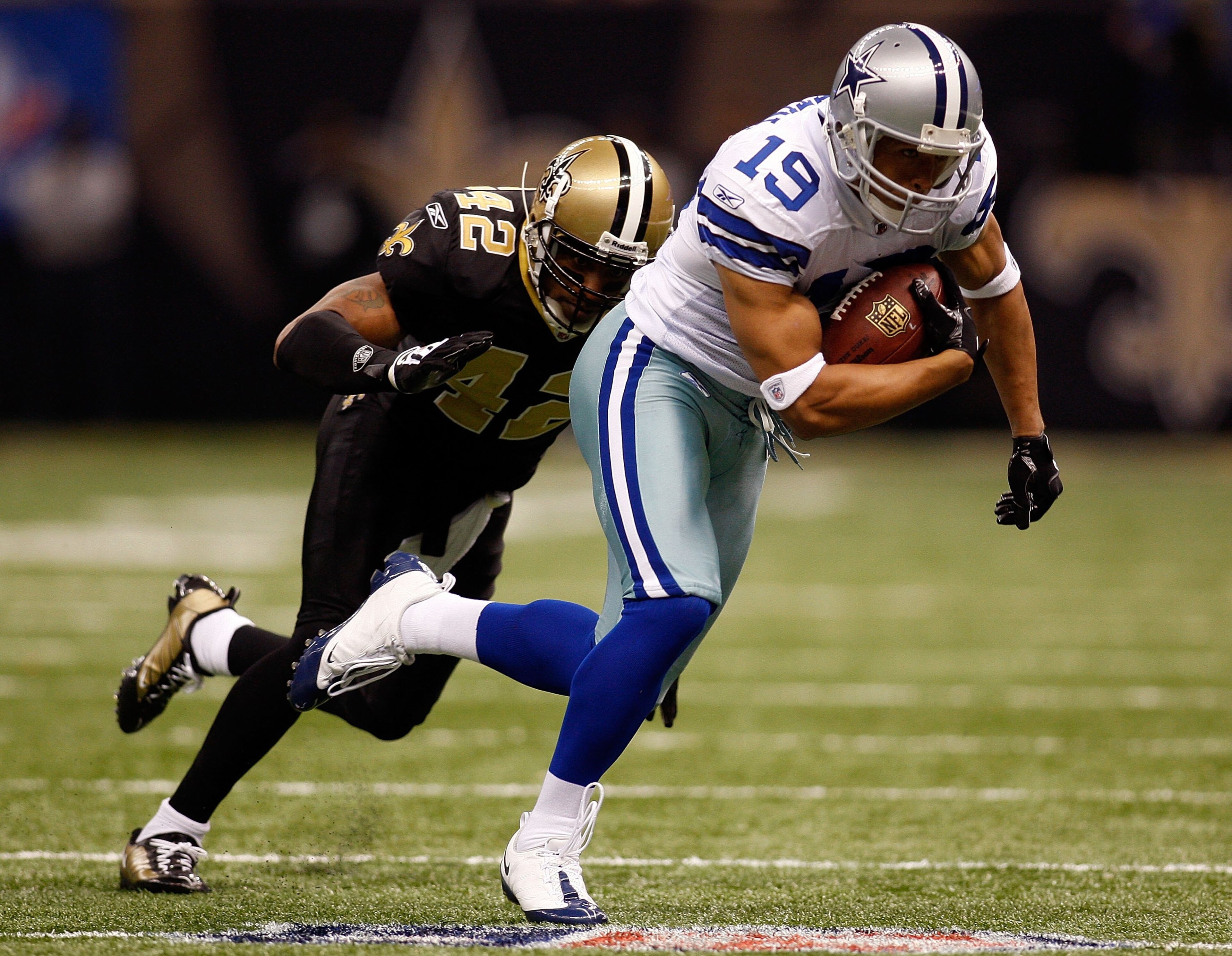 NEW ORLEANS - DECEMBER 19: Miles Austin #19 of the Dallas Cowboys avoids a tackle by Darren Sharper #42 of the New Orleans Saints at the Louisiana Superdome on December 19, 2009 in New Orleans, Louisiana. (Photo by Chris Graythen/Getty Images) NEW ORLEANS - DECEMBER 19: Miles Austin #19 of the Dallas Cowboys avoids a tackle by Darren Sharper #42 of the New Orleans Saints at the Louisiana Superdome on December 19, 2009 in New Orleans, Louisiana. (Photo by Chris Graythen/Getty Images)
