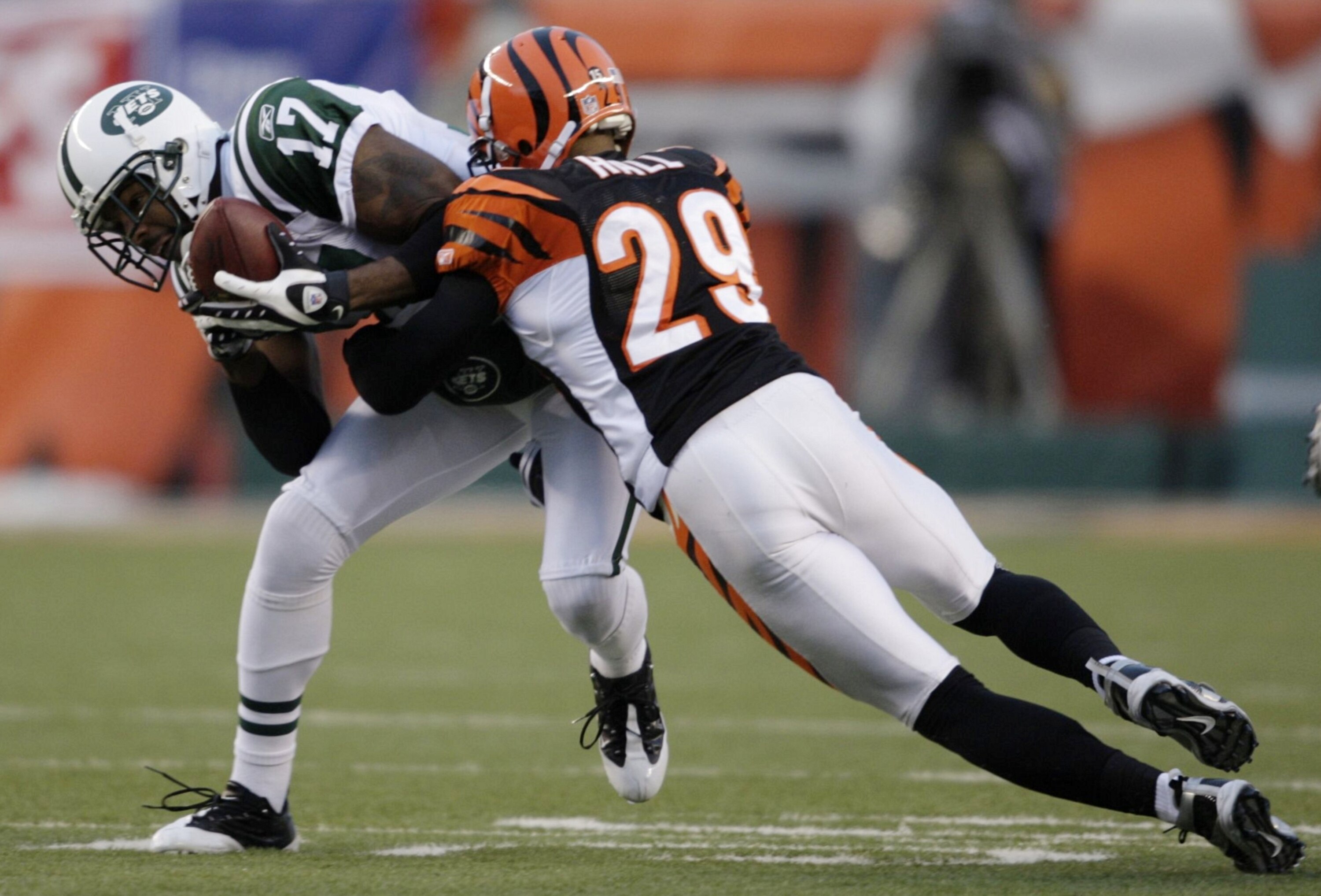 CINCINNATI - JANUARY 9: Wide receiver Braylon Edwards #17 of the New York Jets is tackled by cornerback Leon Hall #29 of the Cincinnati Bengals after a catch during the 2010 AFC wild-card playoff game at Paul Brown Stadium on January 9, 2010 in Cincinnat CINCINNATI - JANUARY 9: Wide receiver Braylon Edwards #17 of the New York Jets is tackled by cornerback Leon Hall #29 of the Cincinnati Bengals after a catch during the 2010 AFC wild-card playoff game at Paul Brown Stadium on January 9, 2010 in Cincinnat