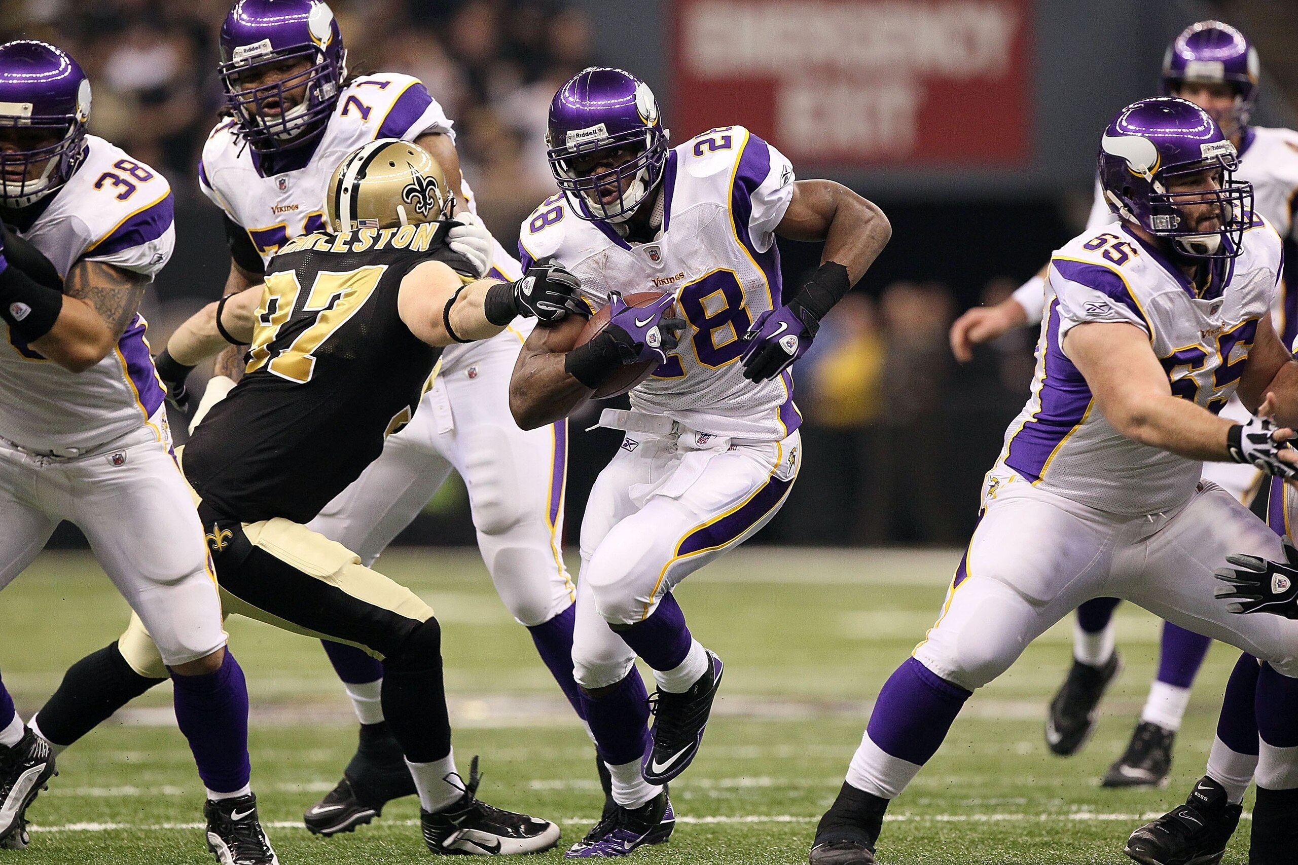 NEW ORLEANS - JANUARY 24:  Adrian Peterson #28 of the Minnesota Vikings runs the ball against the New Orleans Saints during the NFC Championship Game at the Louisiana Superdome on January 24, 2010 in New Orleans, Louisiana. The Saints won 31-28 in overtim