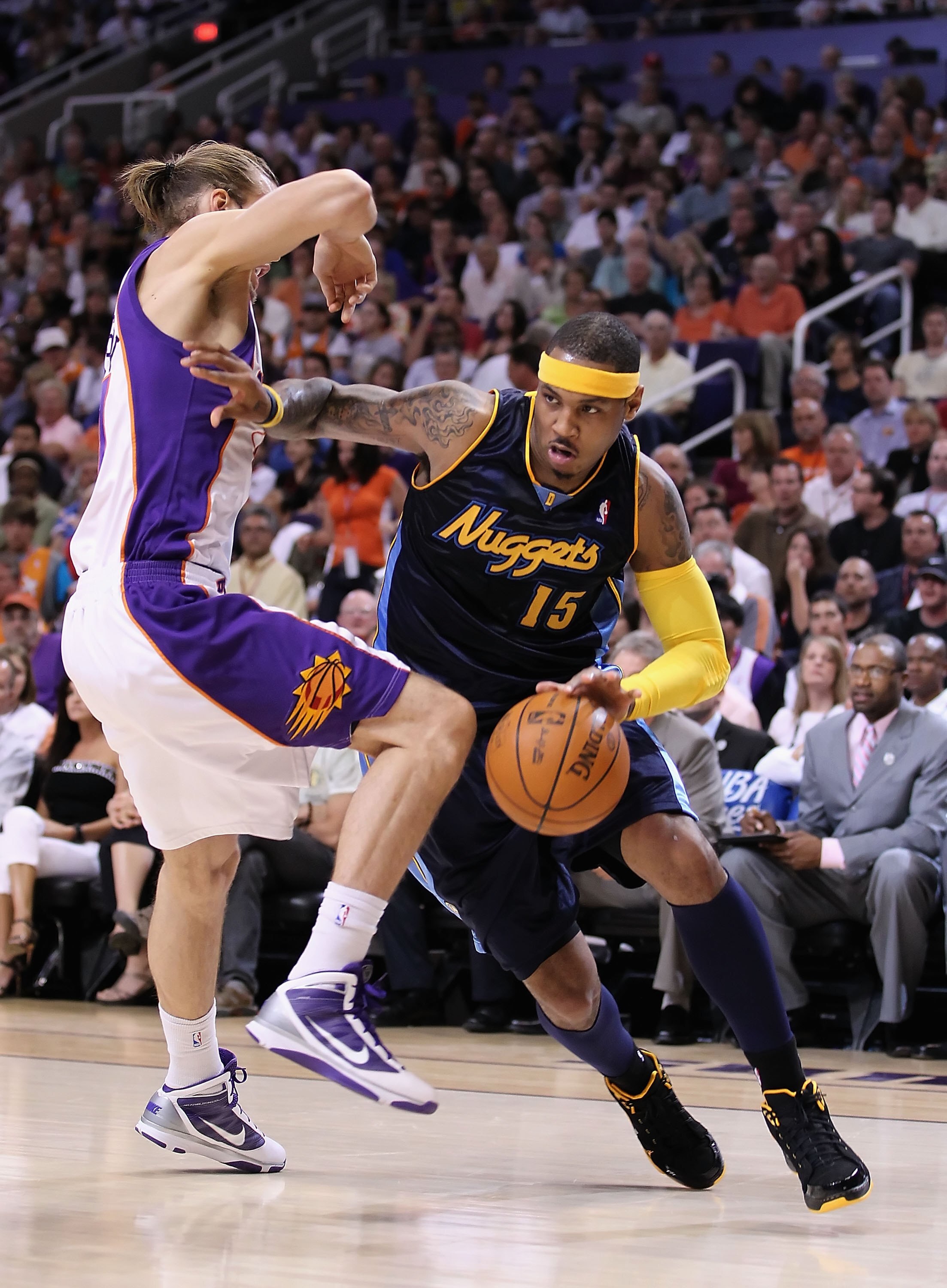 PHOENIX - APRIL 13:  Carmelo Anthony #15 of the Denver Nuggets handles the ball during the NBA game against the Phoenix Suns at US Airways Center on April 13, 2010 in Phoenix, Arizona. The Suns defeated the Nuggets 123-101.  NOTE TO USER: User expressly a