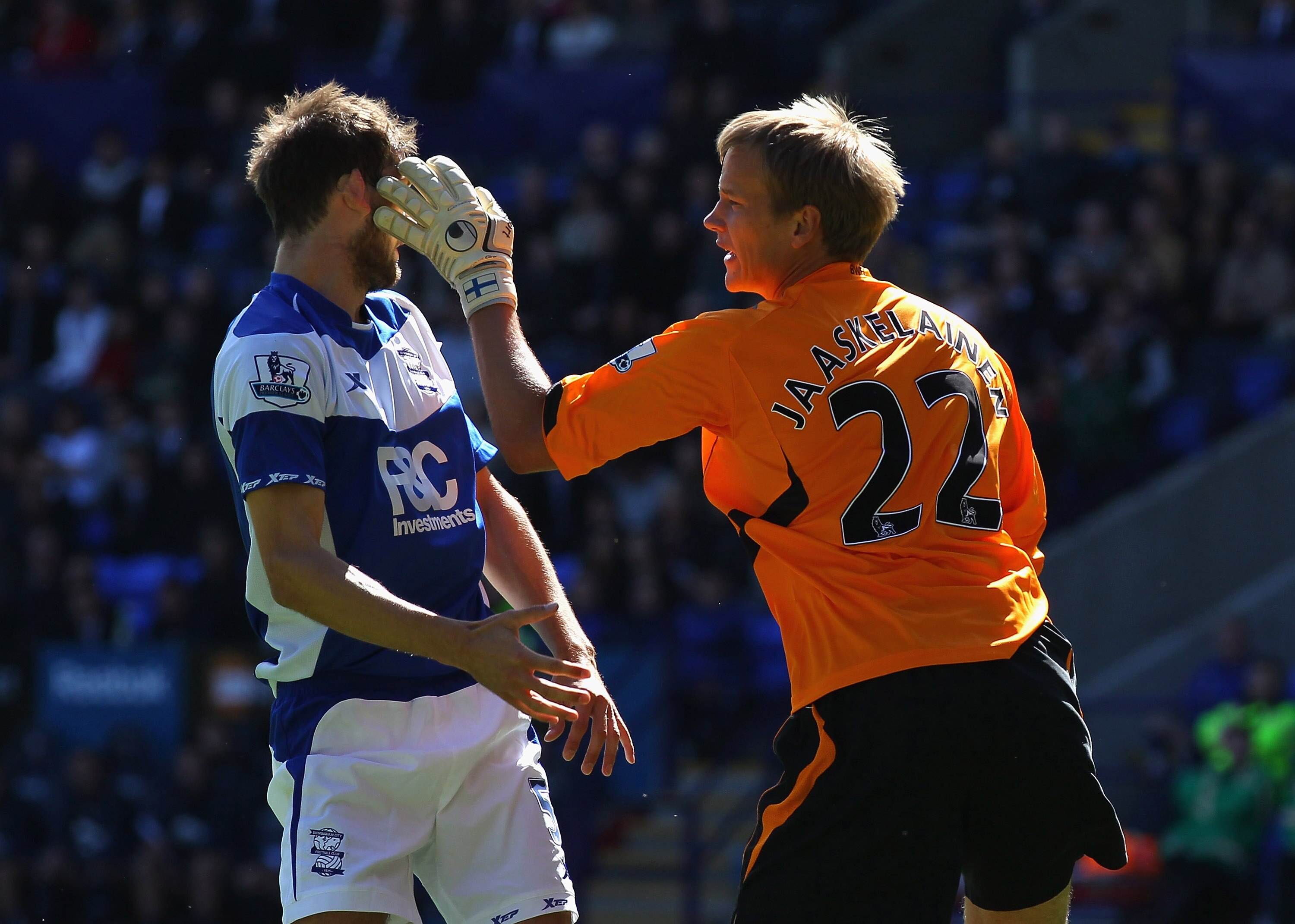 BOLTON, ENGLAND - AUGUST 29:  Jussi Jaaskelainen (R) of Bolton Wanderers and Roger Johnson of Birmingham City clash prior to Jussi Jaaskelainen receiving a red card for the incident during the Barclays Premier League match between Bolton Wanderers and Bir