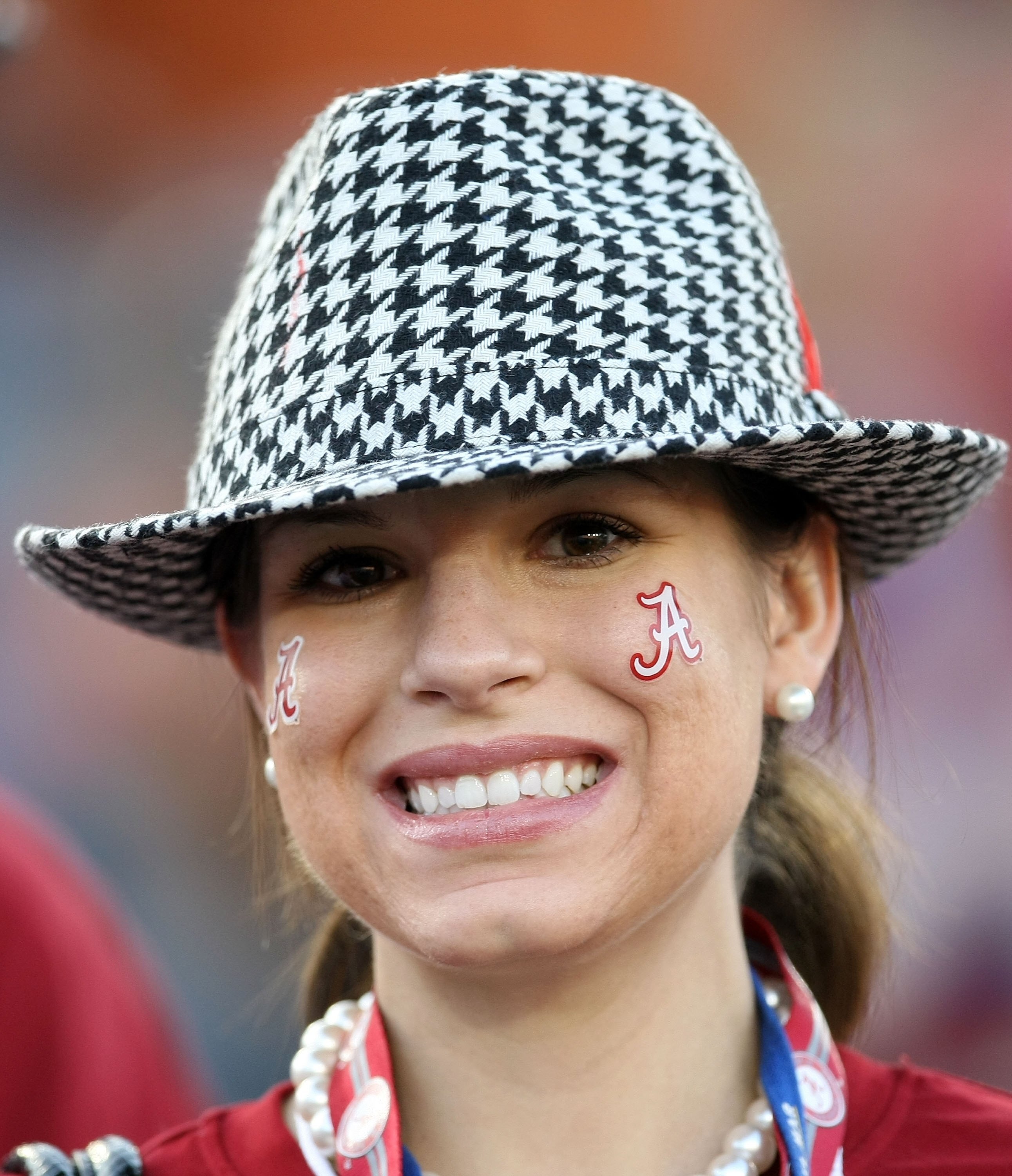 PASADENA, CA - JANUARY 07:  A fan of the Alabama Crimson Tide stands inside the stadium prior to the game against the Texas Longhorns in the Citi BCS National Championship game at the Rose Bowl on January 7, 2010 in Pasadena, California.  (Photo by Stephe