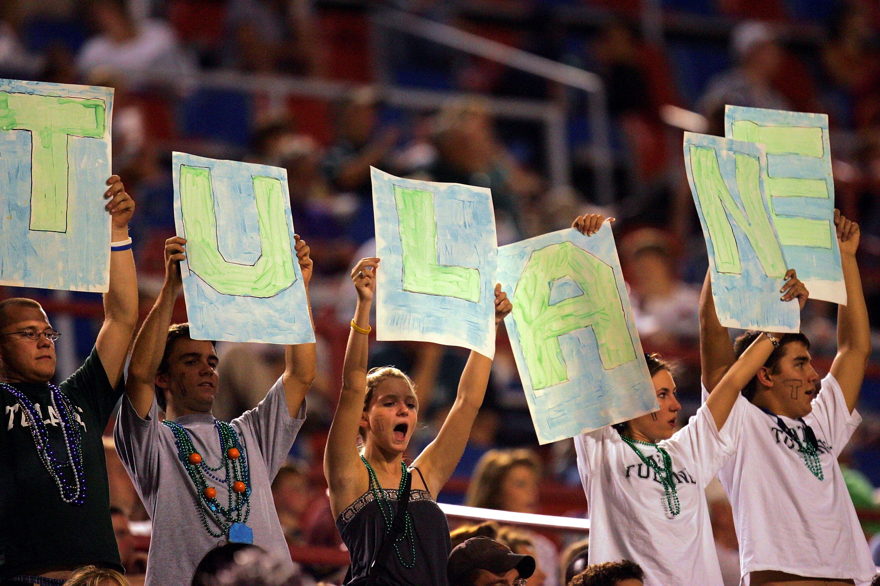 SHREVEPORT, LA - SEPTEMBER 17:  Fans of the Tulane Green Wave cheer during play against the Mississippi State Bulldogs on September 17, 2005 at Independence Stadium in Shreveport, Louisiana. The Bulldogs defeated the Green Wave 21-14.  (Photo by Ronald Ma