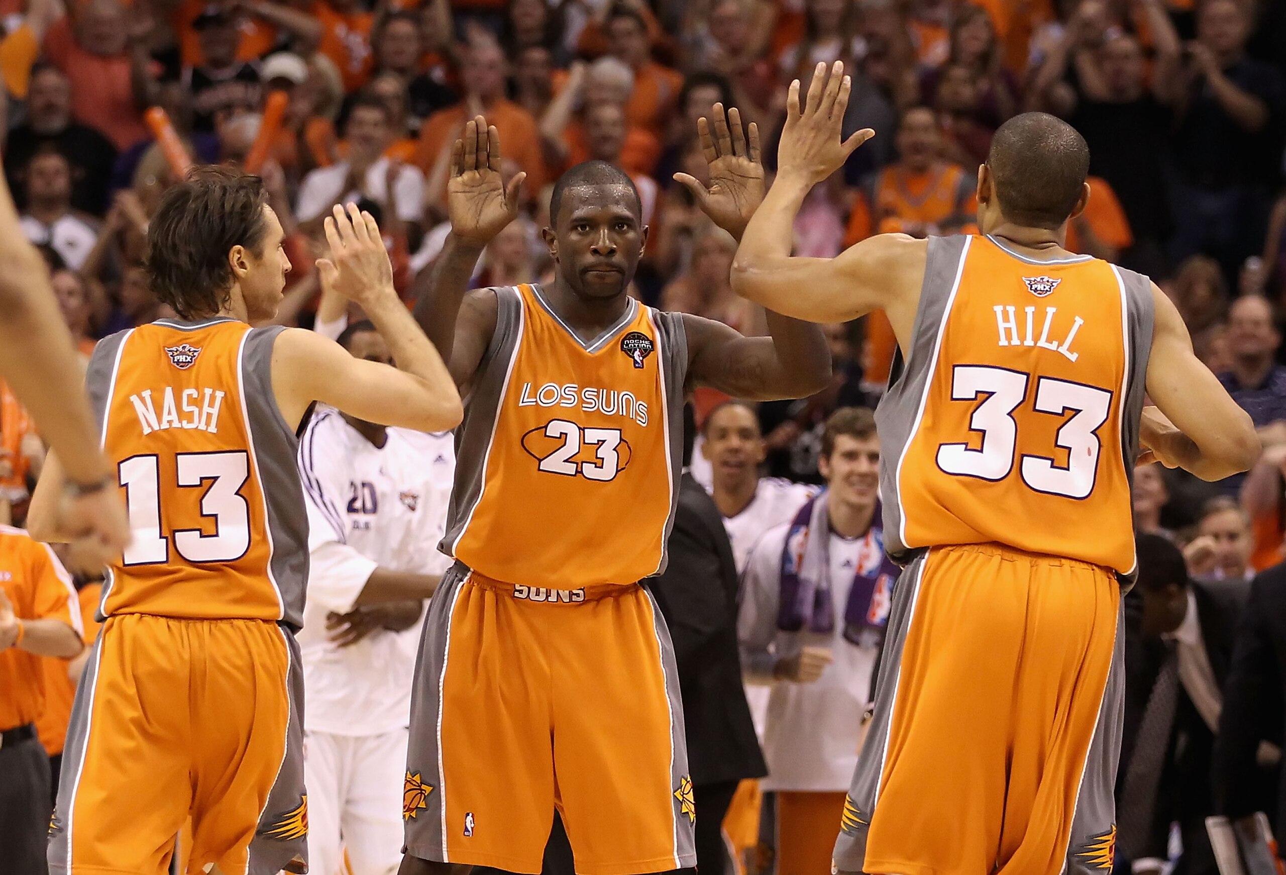 PHOENIX - MAY 05:  Jason Richardson #23 of the Phoenix Suns high fives teammates Steve Nash #13 and Grant Hill #33 after scoring against the San Antonio Spurs during Game Two of the Western Conference Semifinals of the 2010 NBA Playoffs at US Airways Cent