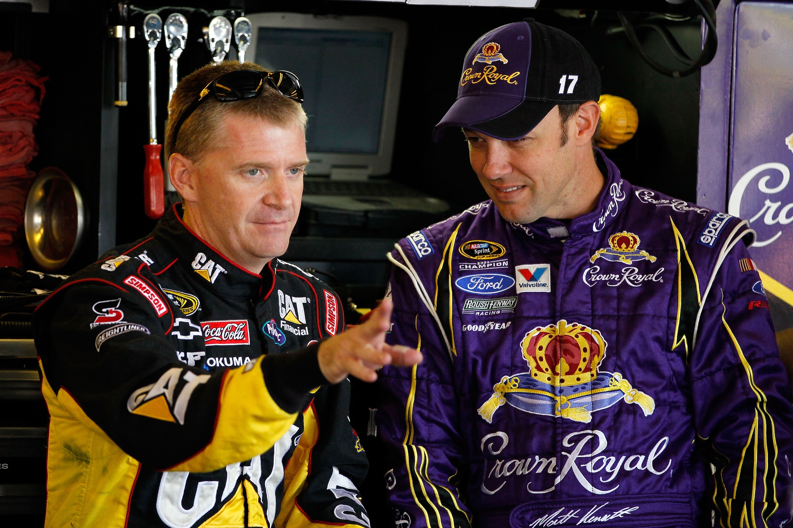 WATKINS GLEN, NY - AUGUST 06:  (L-R) Jeff Burton, driver of the #31 Caterpilliar Chevrolet, and Matt Kenseth, driver of the #17 Crown Royal Ford,  talk in the garage during practice for the NASCAR Heluva Good! Sour Cream Dips at The Glen on August 6, 2010