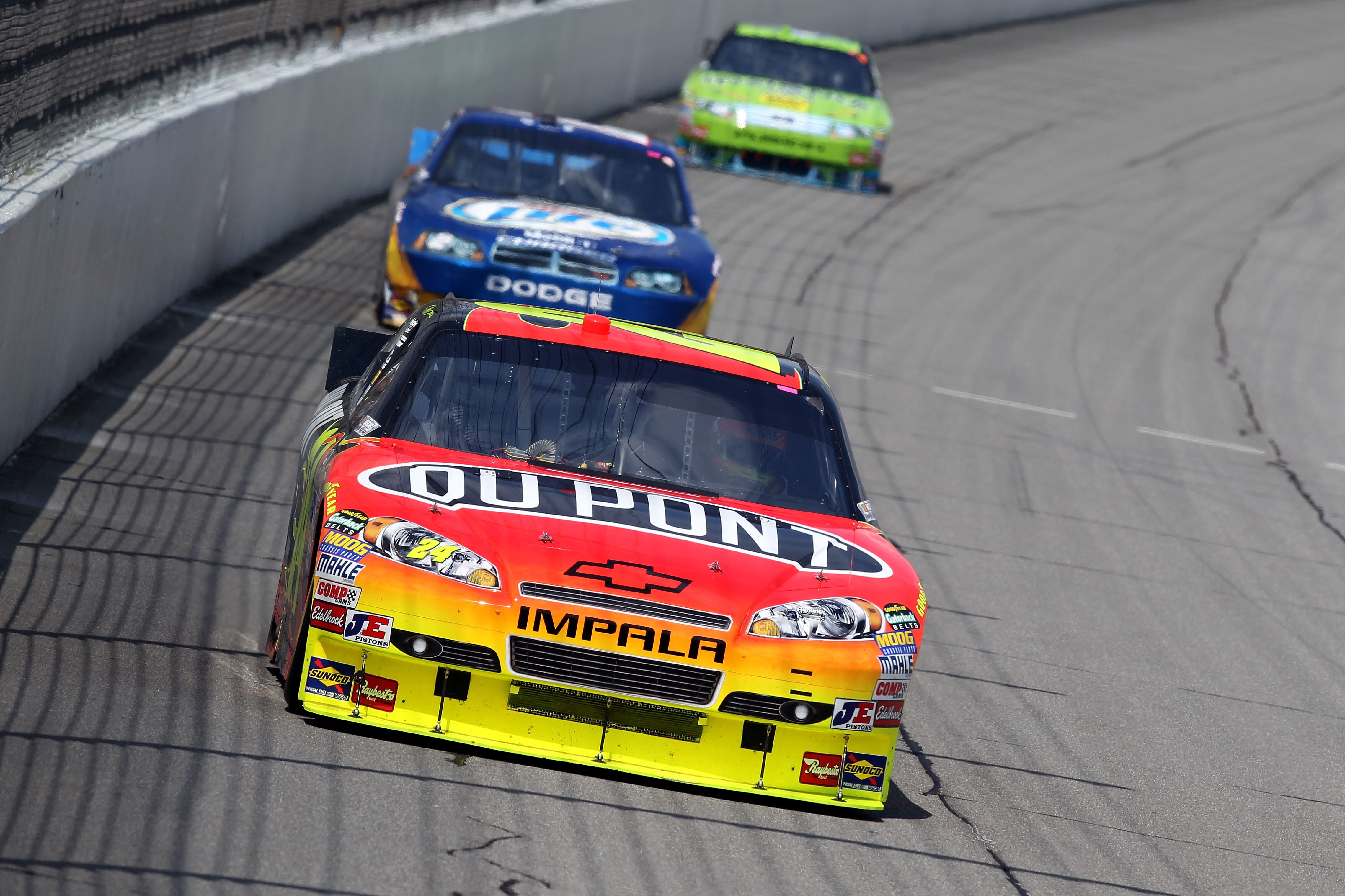 BROOKLYN, MI - AUGUST 15:  Jeff Gordon, driver of the #24 DuPont Chevrolet, leads Kurt Busch, driver of the #2 Miller Lite Dodge, during the NASCAR Sprint Cup Series CARFAX 400 at Michigan International Speedway on August 15, 2010 in Brooklyn, Michigan.