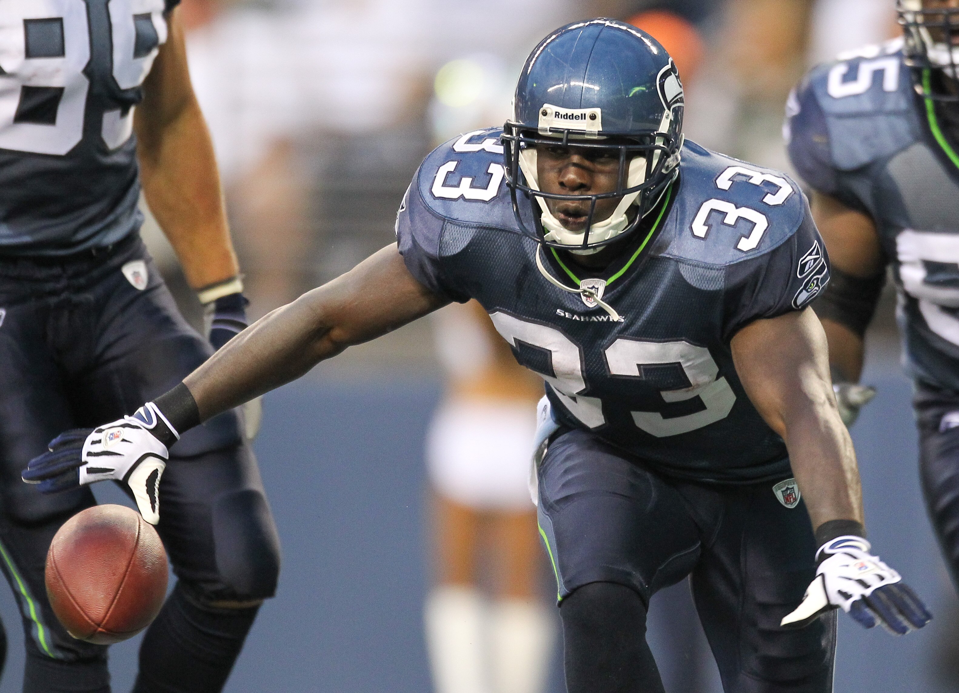 SEATTLE - AUGUST 21:  Running back Leon Washington #33 of the Seattle Seahawks celebrates after scoring a touchdown during the preseason game against the Green Bay Packers at Qwest Field on August 21, 2010 in Seattle, Washington. (Photo by Otto Greule Jr/