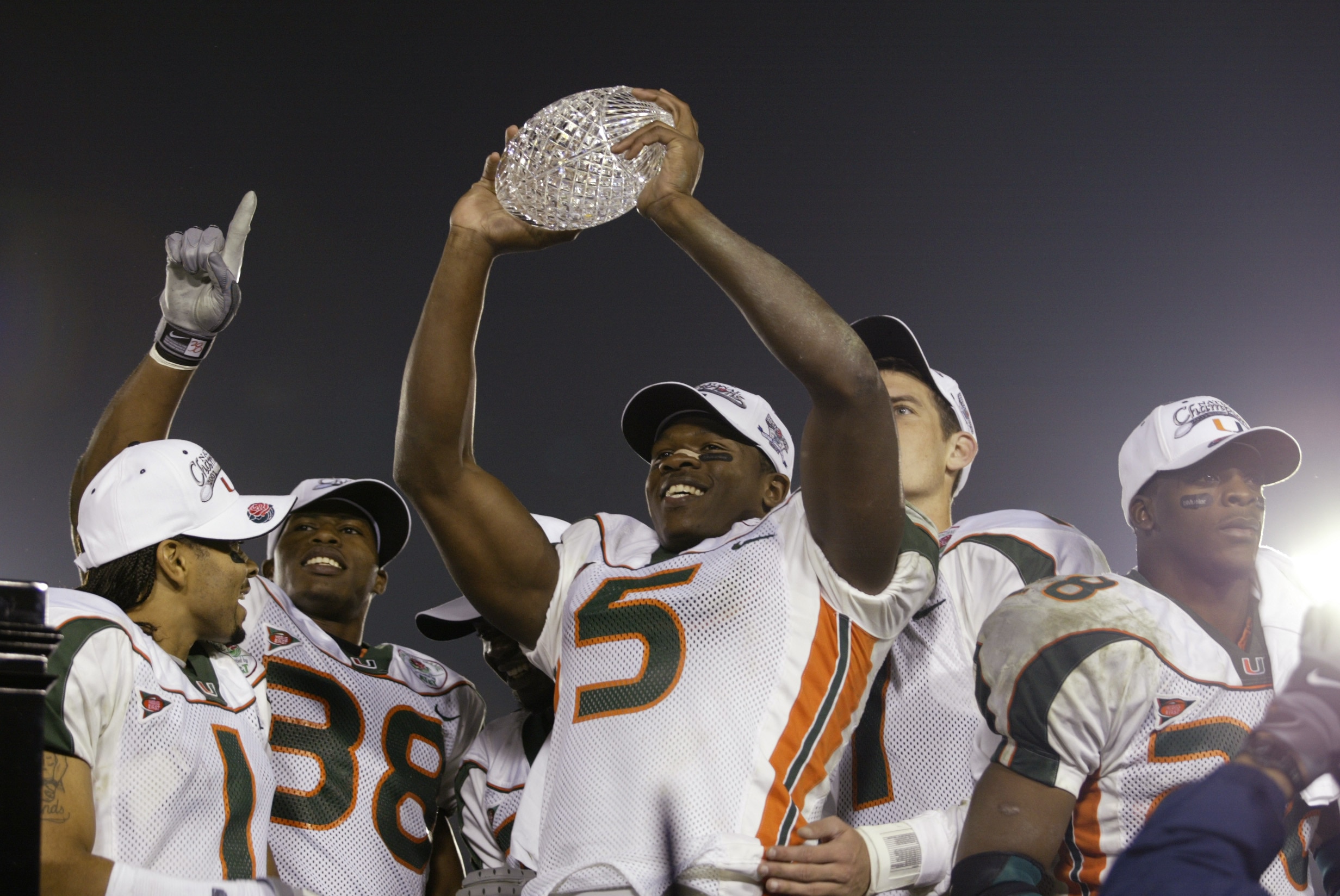 3 Jan 2002:  Andre Johnson #5 of Miami holds the Sears National Championship trophy aloft after winning the Rose Bowl National Championship game over Nebraska at the Rose Bowl in Pasadena, California.  Miami won the game 37-14, winning the BCS and the Nat