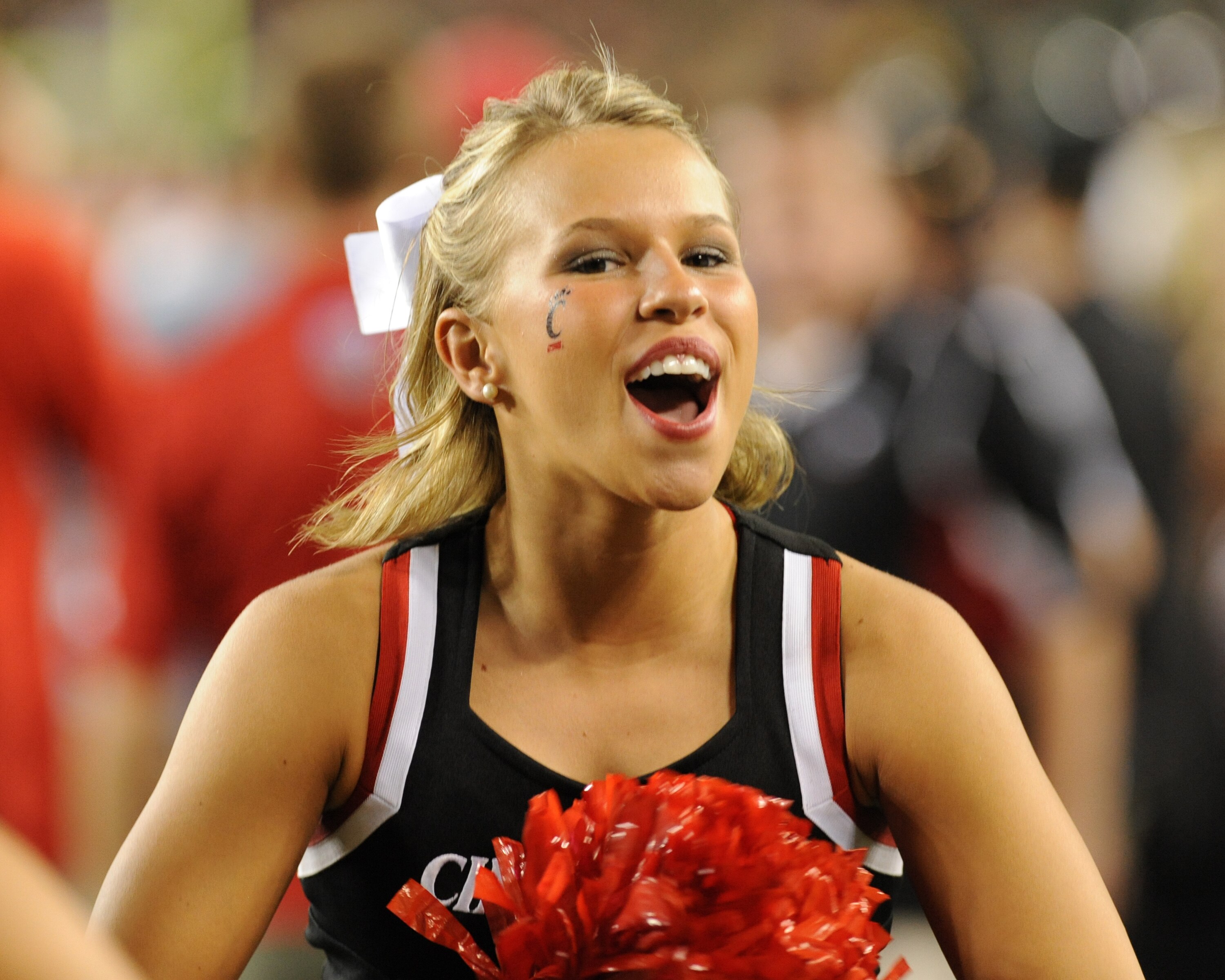 TAMPA, FL - OCTOBER 15: A cheerleader for the Cincinnati Bearcats watches play against the University of South Florida Bulls October 15, 2009 at Raymond James Stadium in Tampa, Florida.  (Photo by Al Messerschmidt/Getty Images)