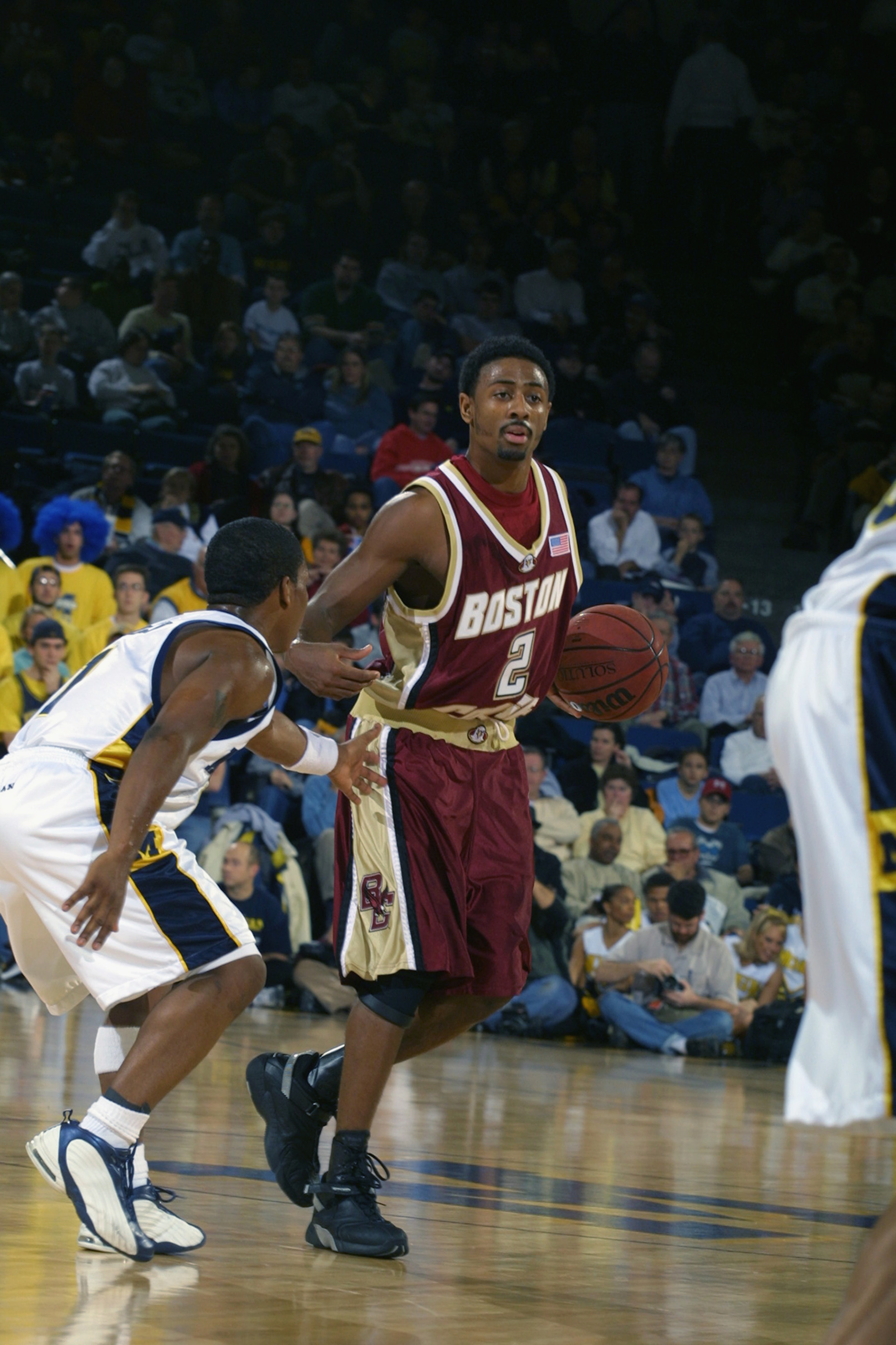 ANN ARBOR, MI - DECEMBER 1: Guard Troy Bell #2 of the Boston College Eagles dribbles the ball against guard Avery Queen #1 of the Michigan Wolverines during the game at Crisler Arena in Ann Arbor, Michigan on December 1, 2001. Boston College defeated Mi ANN ARBOR, MI - DECEMBER 1: Guard Troy Bell #2 of the Boston College Eagles dribbles the ball against guard Avery Queen #1 of the Michigan Wolverines during the game at Crisler Arena in Ann Arbor, Michigan on December 1, 2001. Boston College defeated Mi