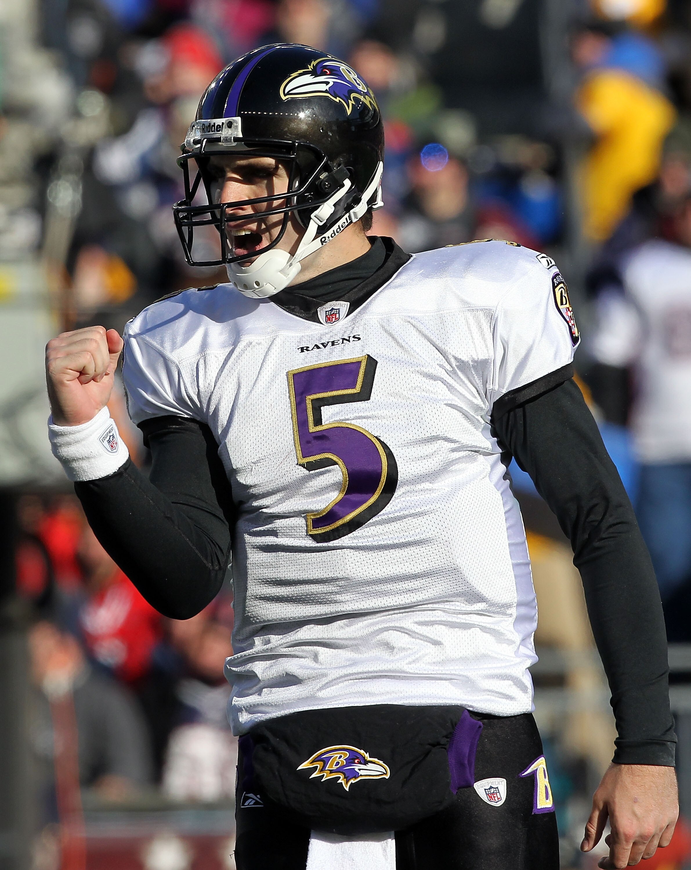 FOXBORO, MA - JANUARY 10:  Joe Flacco #5 of the Baltimore Ravens reacts after Ray Rice scored a 1-yard touchdown in the first quarter against the New England Patriots during the 2010 AFC wild-card playoff game at Gillette Stadium on January 10, 2010 in Fo
