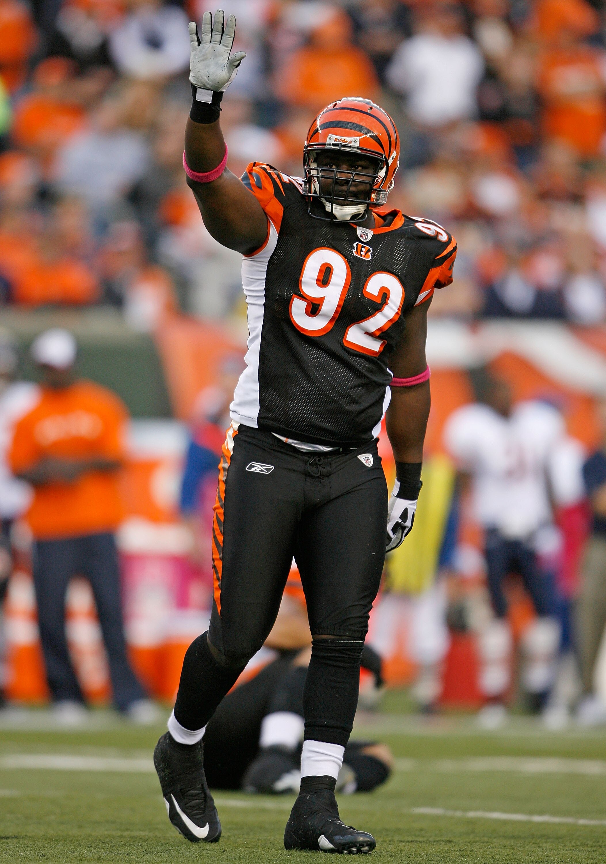 CINCINNATI - OCTOBER 25: Frostee Rucker #92  of the Cincinnati Bengals waves to the crowd after a tackle during the NFL game against the Chicago Bears at Paul Brown Stadium on October 25, 2009 in Cincinnati, Ohio.  The Bengals won 45-10.  (Photo by Andy L