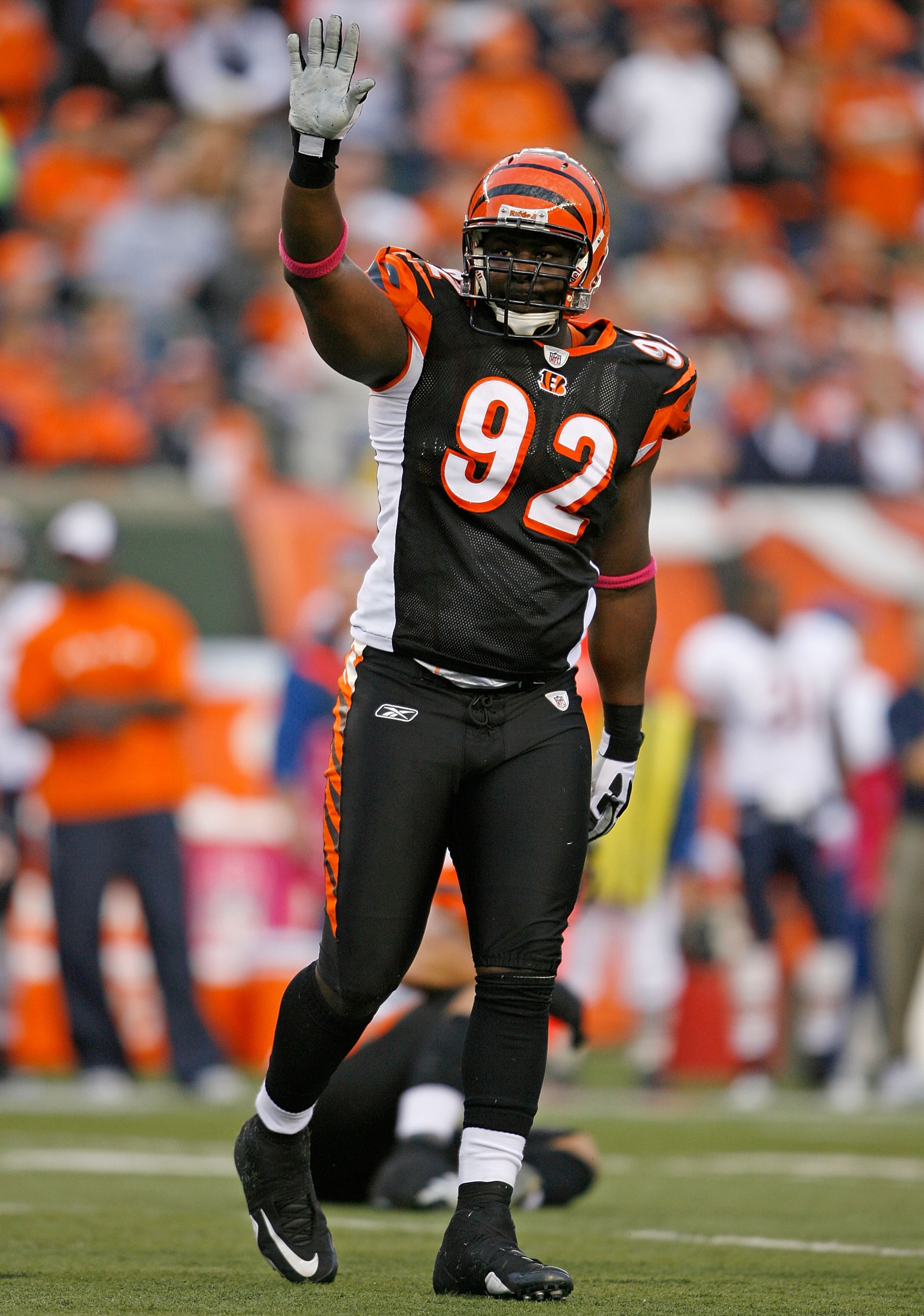 CINCINNATI - OCTOBER 25: Frostee Rucker #92  of the Cincinnati Bengals waves to the crowd after a tackle during the NFL game against the Chicago Bears at Paul Brown Stadium on October 25, 2009 in Cincinnati, Ohio.  The Bengals won 45-10.  (Photo by Andy L