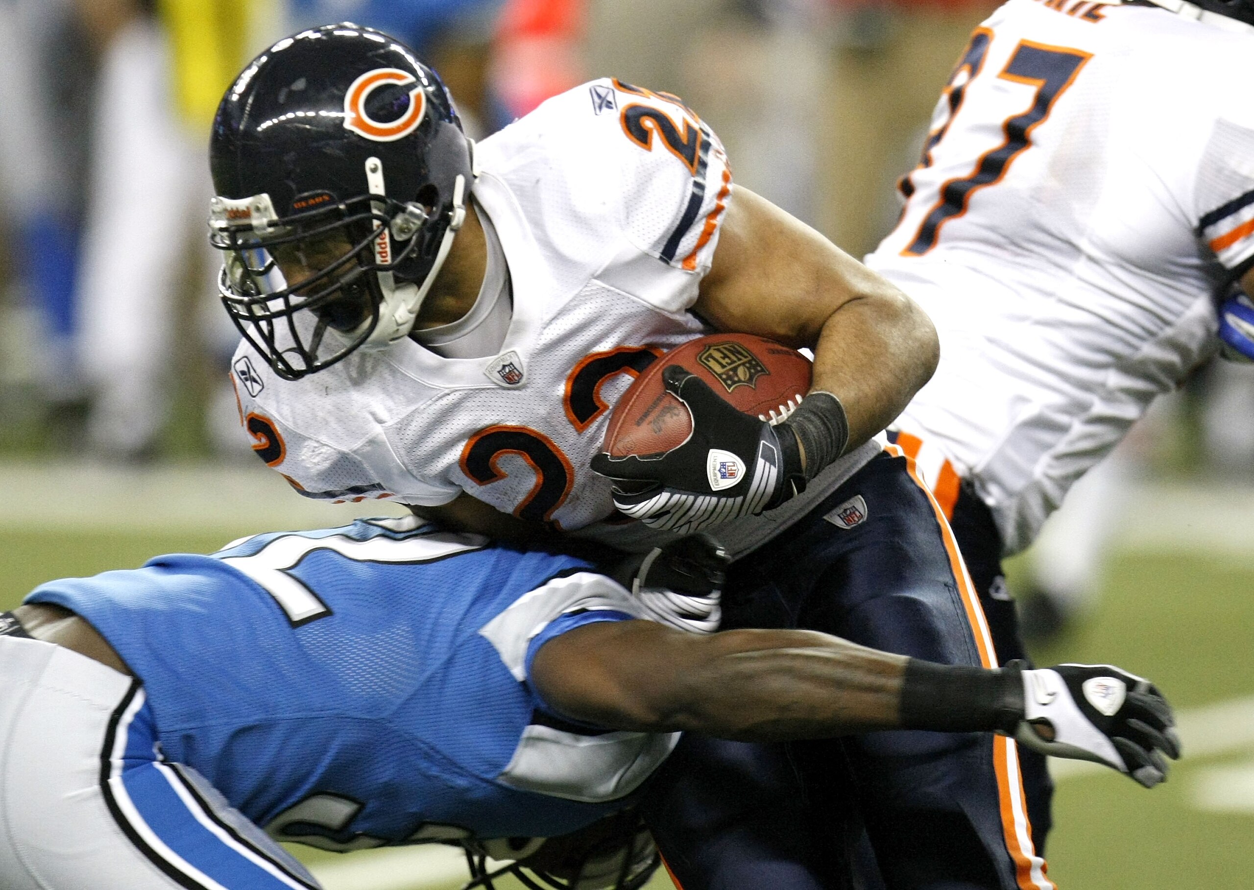 DETROIT - JANUARY 03: Matt Forte #22 of the Chicago Bears is tackled during a fourth quarter run by Anthony Henry #32 of the Detroit Lions on January 3, 2010 at Ford Field in Detroit, Michigan. Chicago won the game 37-23. (Photo by Gregory Shamus/Getty Im
