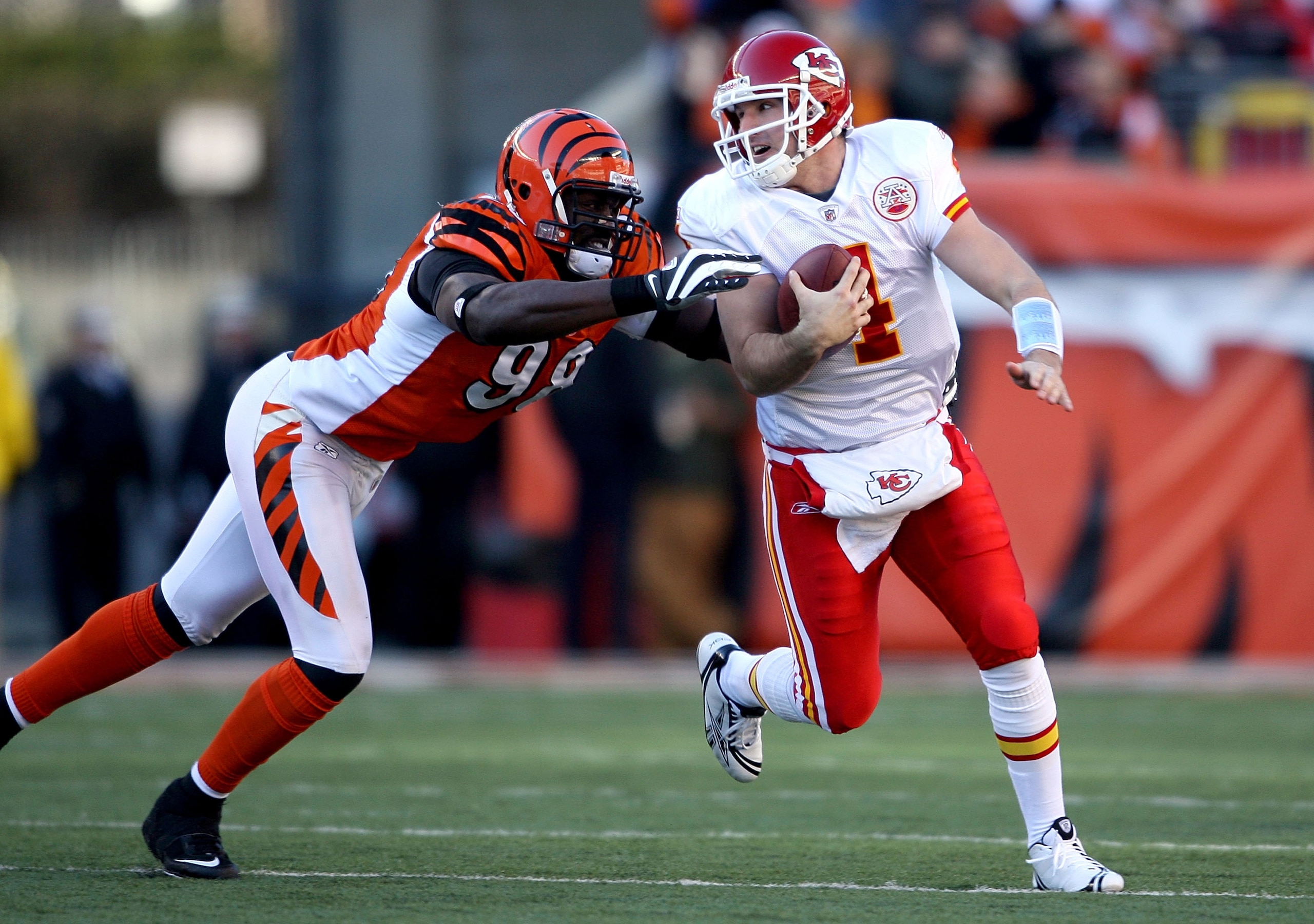 CINCINNATI - DECEMBER 28: Tyler Thigpen #4 of the Kansas City Chiefs runs with the ball while defended by Antwan Odom #98 of the Cincinnati Bengals during the NFL game on December 28, 2008 at Paul Brown Stadium in Cincinnati, Ohio. (Photo by Andy Lyons/Ge