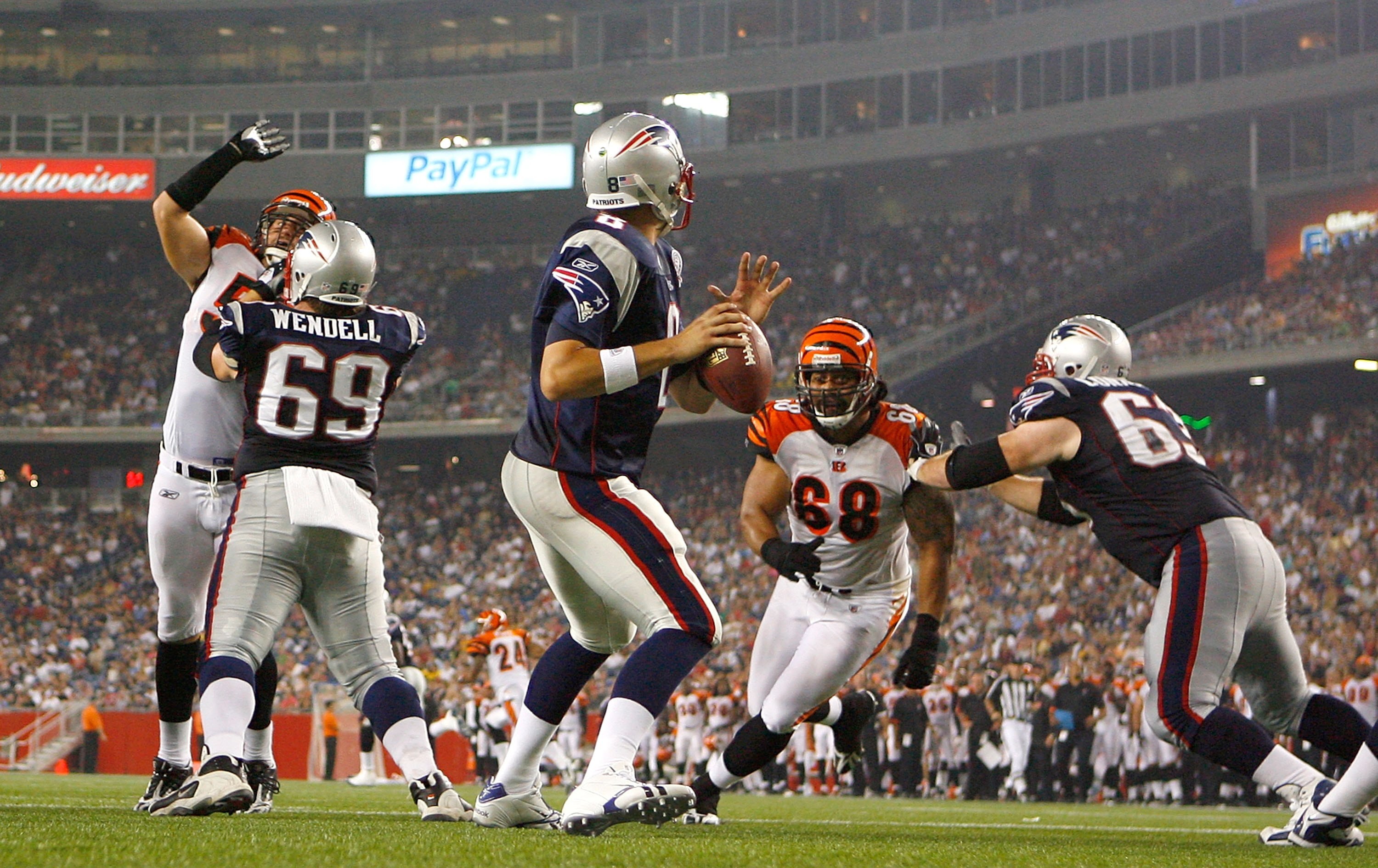 FOXBORO, MA - AUGUST 20:  Brian Hoyer #8 of the New England Patriots feels the pressure of Jonathan Fanene #68 of the Cincinnati Bengals at Gillette Stadium on August 20, 2009 in Foxboro, Massachusetts. (Photo by Jim Rogash/Getty Images)