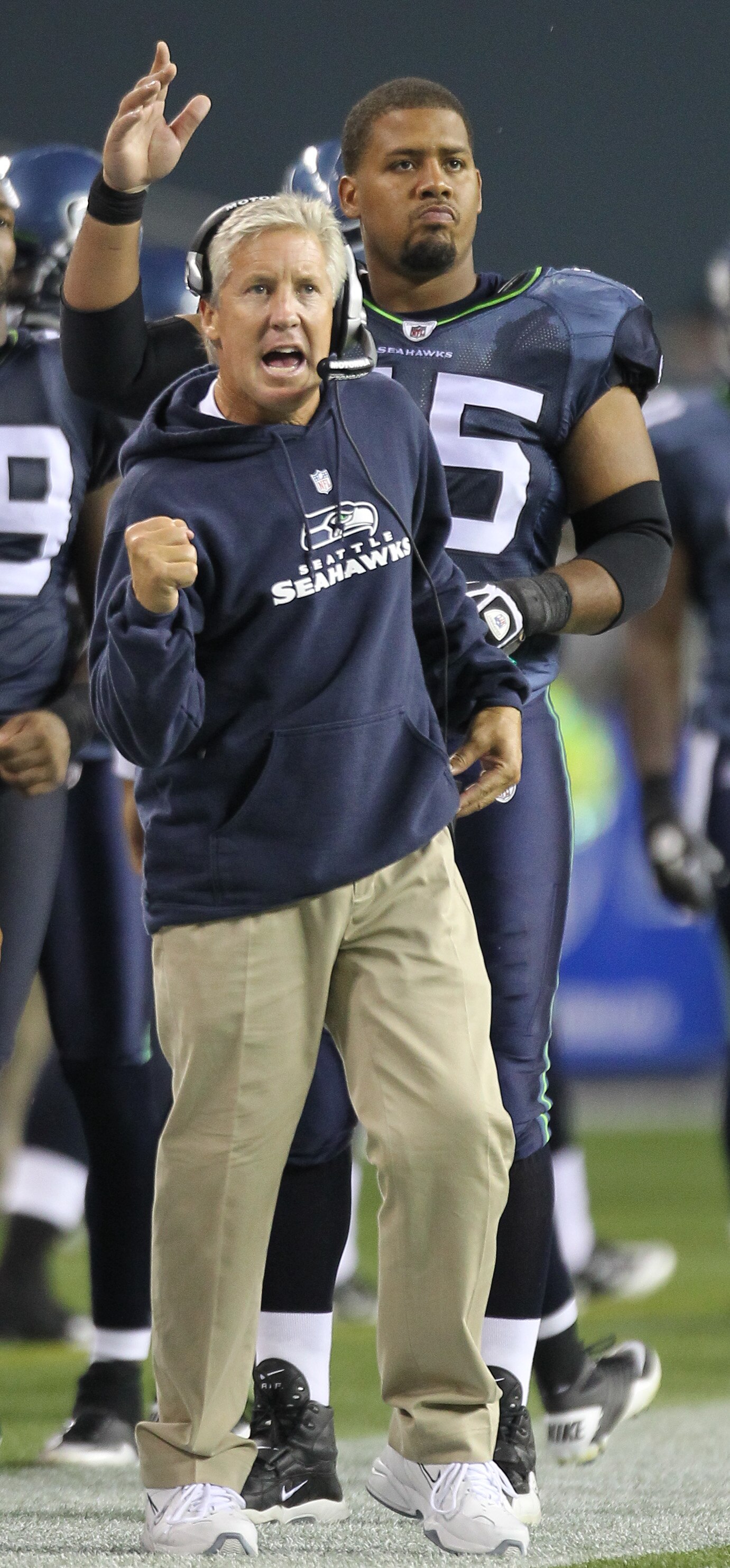 SEATTLE - AUGUST 21:  Head coach Pete Carroll of the Seattle Seahawks and Sean Locklear #75 react after the Seahawks scored a touchdown during the preseason game against the Green Bay Packers at Qwest Field on August 21, 2010 in Seattle, Washington. (Phot