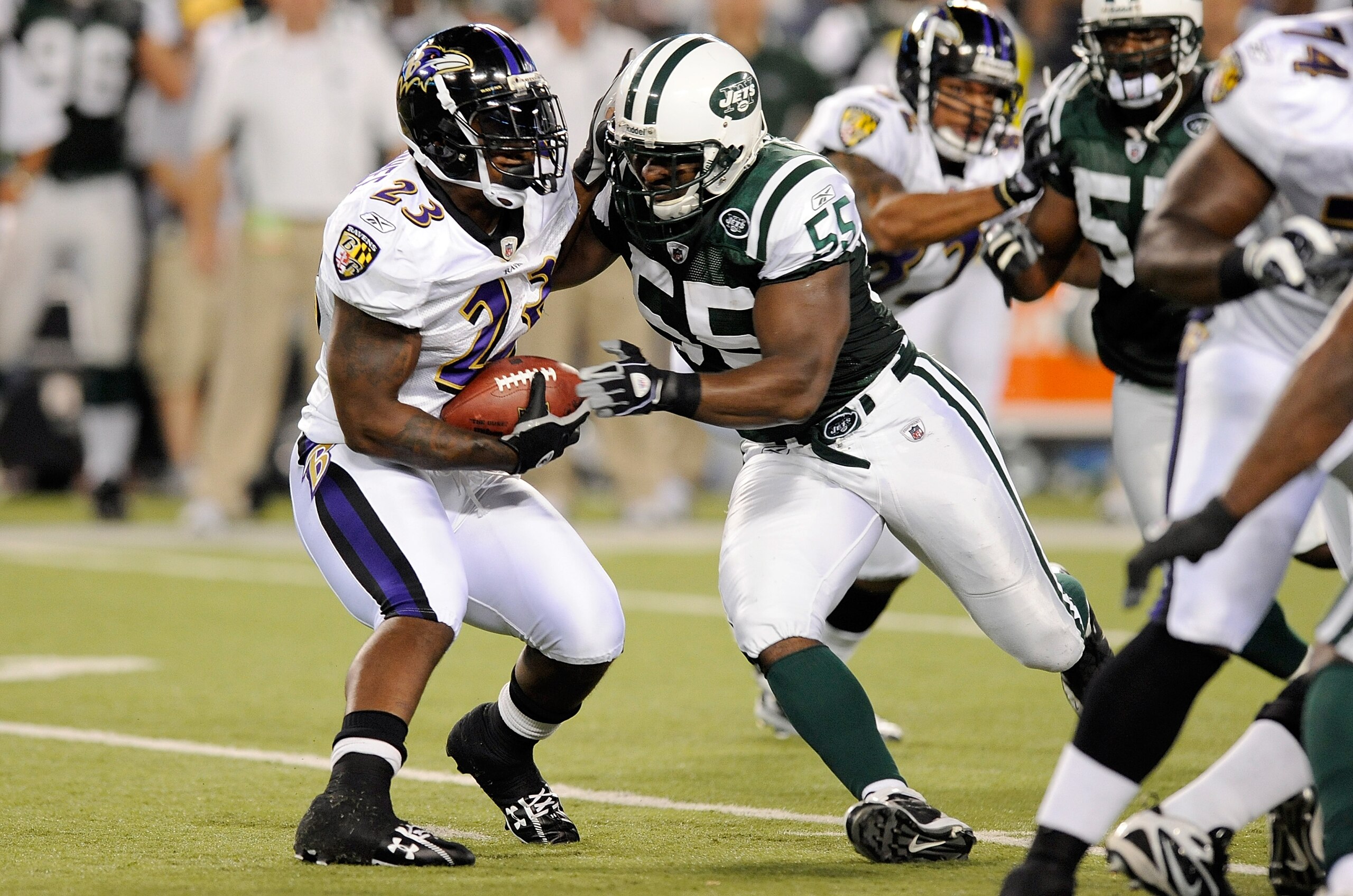 BALTIMORE - AUGUST 24:   Willis McGahee #23 of the Baltimore Ravens is tackled by Jamaal Westerman of the New York Jets during a preseason game at M&T Bank Stadium on August 24, 2009 in Baltimore, Maryland.  (Photo by Greg Fiume/Getty Images)