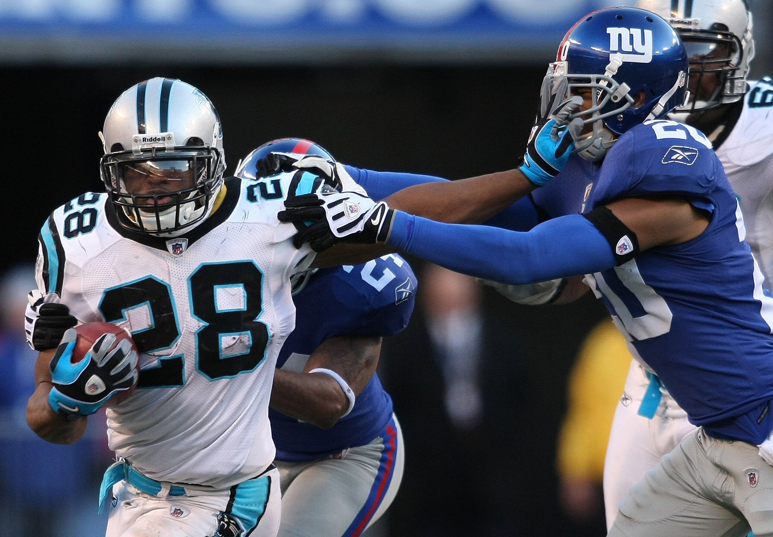 EAST RUTHERFORD, NJ - DECEMBER 27:  Jonathan Stewart #28 of the Carolina Panthers rushes against the New York Giants at Giants Stadium on December 27, 2009 in East Rutherford, New Jersey.  (Photo by Nick Laham/Getty Images)