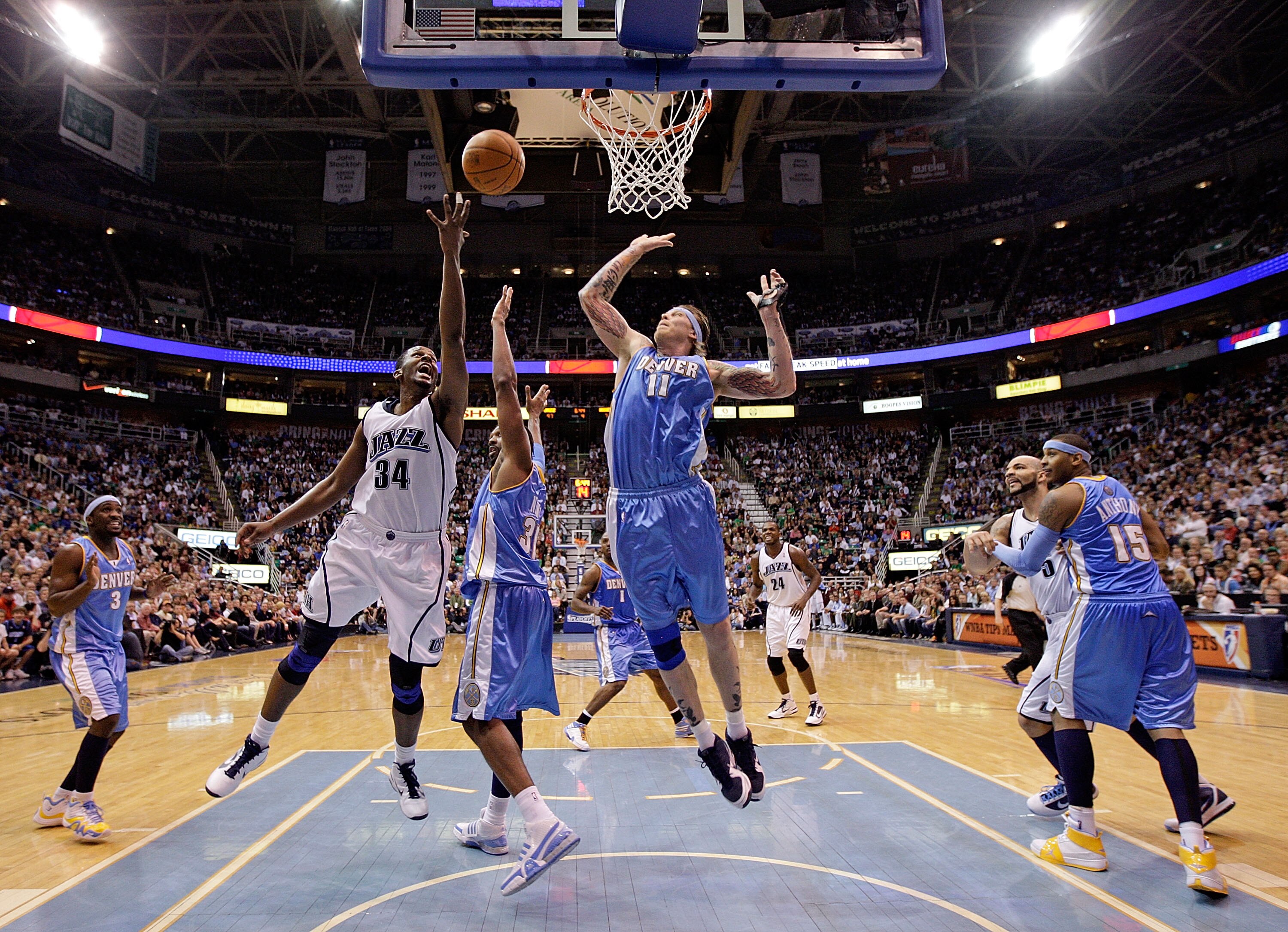 SALT LAKE CITY - APRIL 23:  C.J. Miles #34 of the Utah Jazz shoots the ball while defended by Chris Anderson #11 of the Denver Nuggets during  Game 3 of the Western Conference Quarterfinals of the 2010 NBA Playoffs at EnergySolutions Arena on April 23, 20