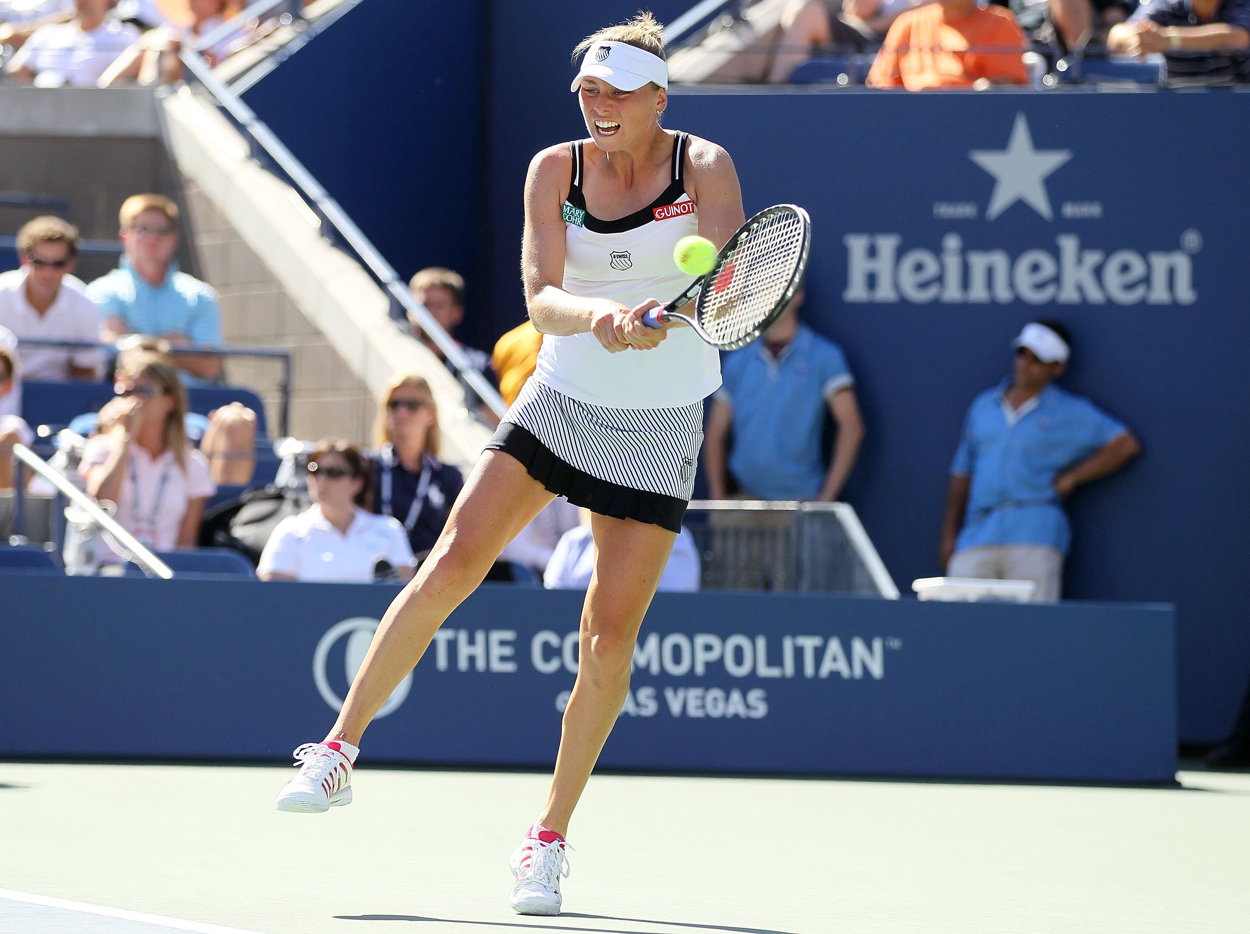 NEW YORK - SEPTEMBER 08: Vera Zvonareva of Russia returns a shot against Kaia Kanepi of Estonia during her women's singles quarterfinal match on day ten of the 2010 U.S. Open at the USTA Billie Jean King National Tennis Center on September 8, 2010 in the NEW YORK - SEPTEMBER 08: Vera Zvonareva of Russia returns a shot against Kaia Kanepi of Estonia during her women's singles quarterfinal match on day ten of the 2010 U.S. Open at the USTA Billie Jean King National Tennis Center on September 8, 2010 in the