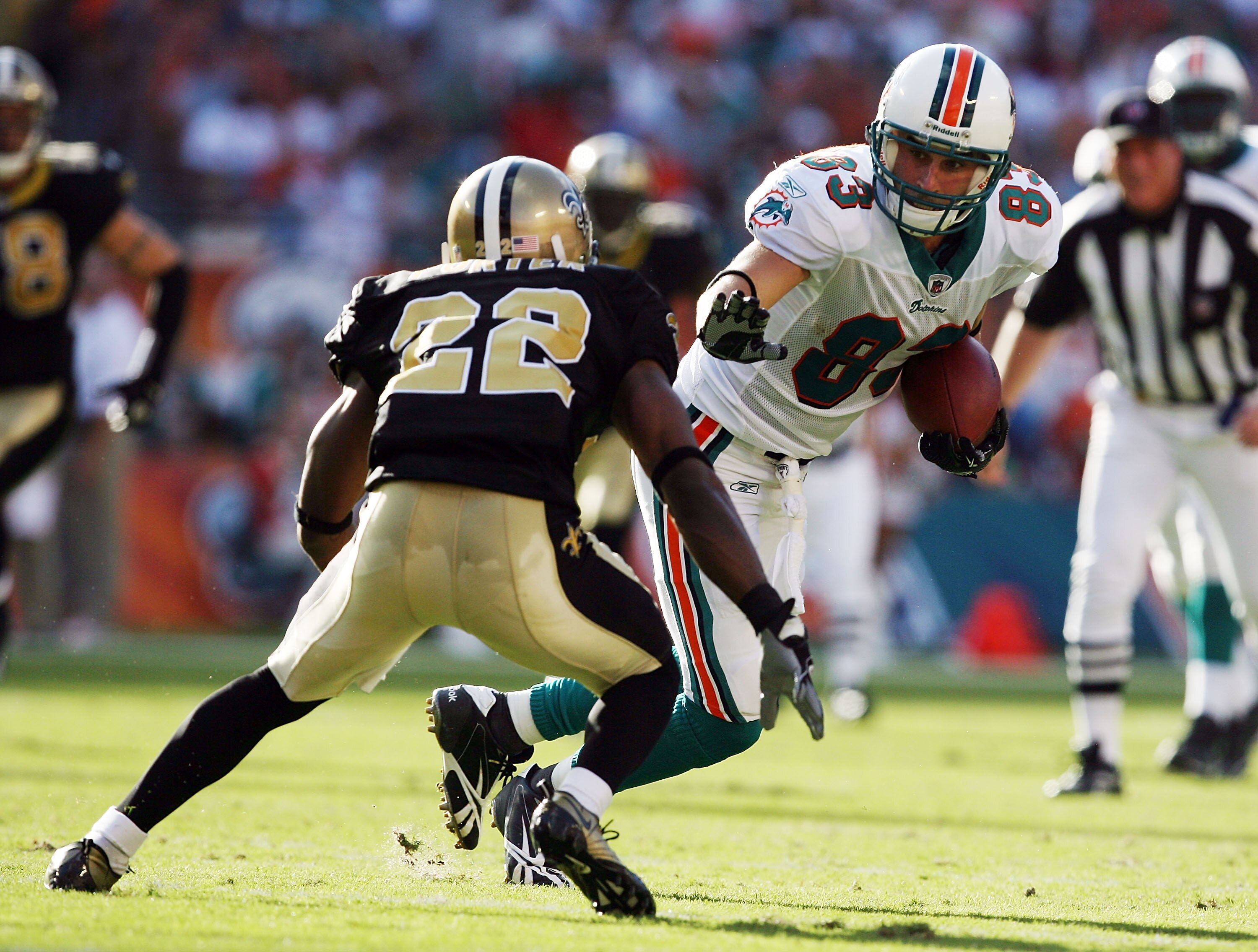 MIAMI - OCTOBER 25:  Cornerback Tracy Porter #22 of the New Orleans Saints tracks down wide receiver Greg Camarillo #83 of the Miami Dolphins at Land Shark Stadium on October 25, 2009 in Miami, Florida.  (Photo by Doug Benc/Getty Images)