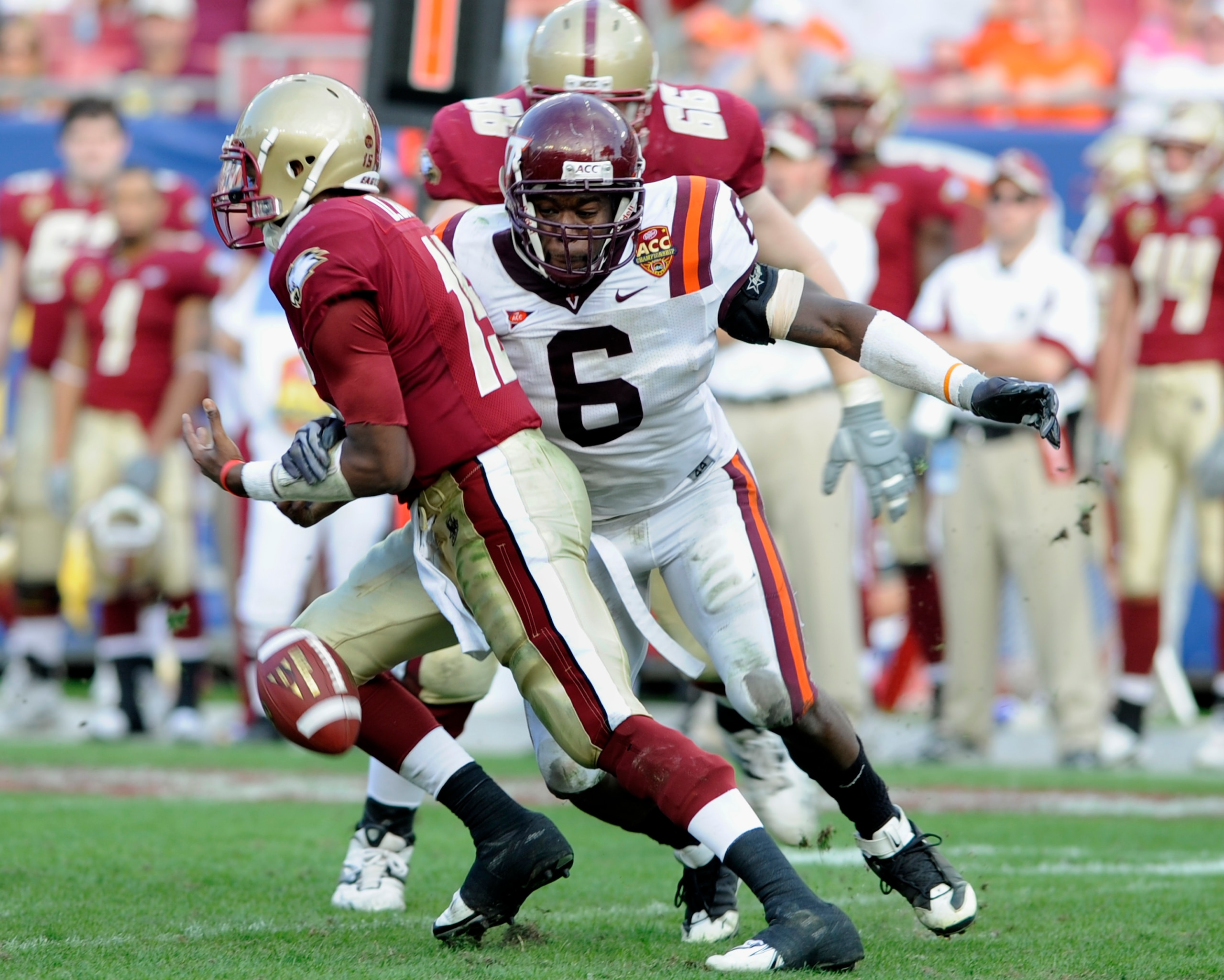 TAMPA, FL - DECEMBER 6: Defensive end Jason Worilds #6 of the Virginia Tech Hokies forces a fumble by quarterback Dominique Davis #15 of the Boston College Eagles in the 2008 ACC Football Championship game at Raymond James Stadium on December 6, 2008 in T