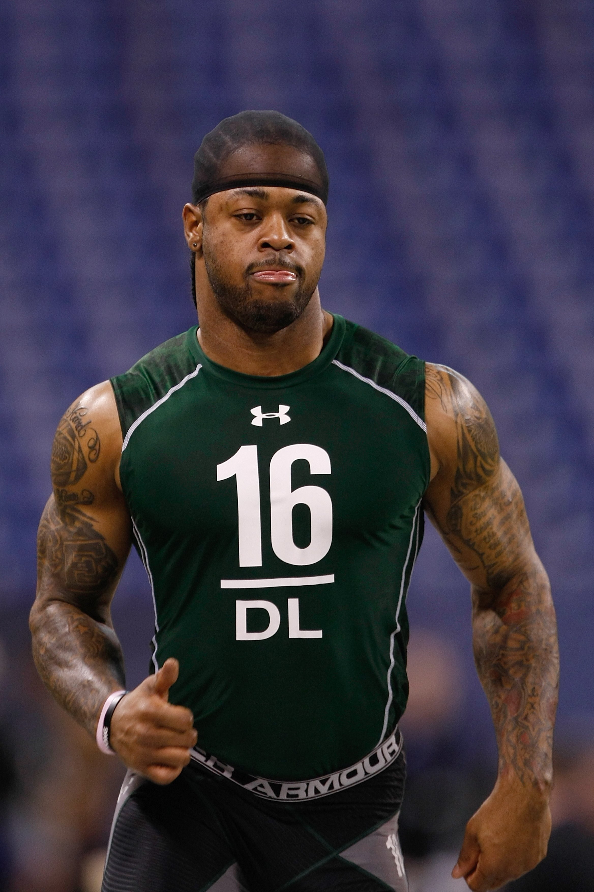 INDIANAPOLIS, IN - MARCH 1: Defensive lineman Thaddeus Gibson of Ohio State runs the 40 yard dash during the NFL Scouting Combine presented by Under Armour at Lucas Oil Stadium on March 1, 2010 in Indianapolis, Indiana. (Photo by Scott Boehm/Getty Images)