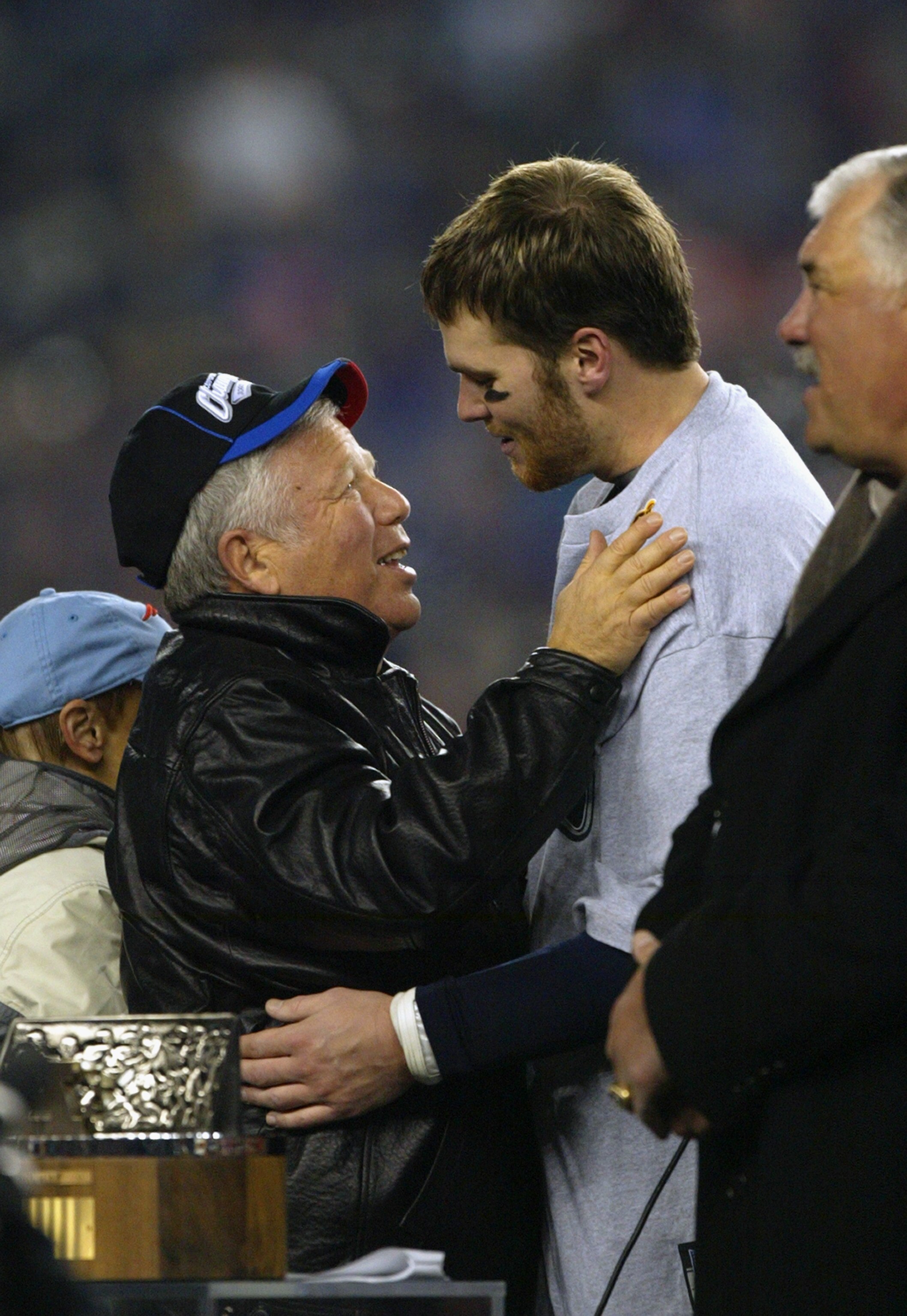 FOXBORO, MA - JANUARY 18:  Owner Robert K. Kraft of the New England Patriots celebrates with Patriots quarterback Tom Brady #12 after winning the AFC Championship Game against the Indianapolis Colts at Gillette Stadium on January 18, 2004 in Foxboro, Mass