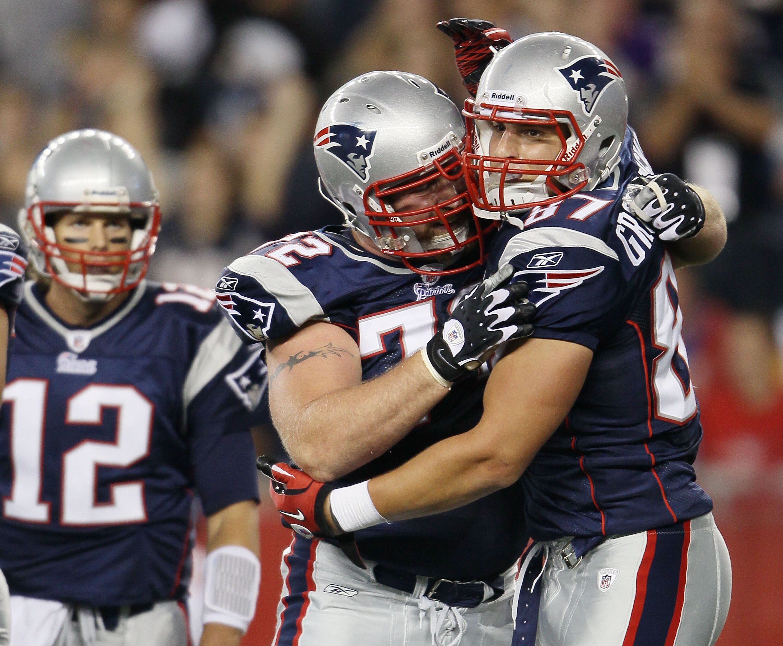 FOXBORO, MA - AUGUST 26:  Rob Gronkowski #87 of the New England Patriots is congratulated by teammate Matt Light #72 and Tom Brady #12 after Gronkowski scored a touchdown against  the St. Louis Rams defends on August 26, 2010 at Gillette Stadium in Foxbor