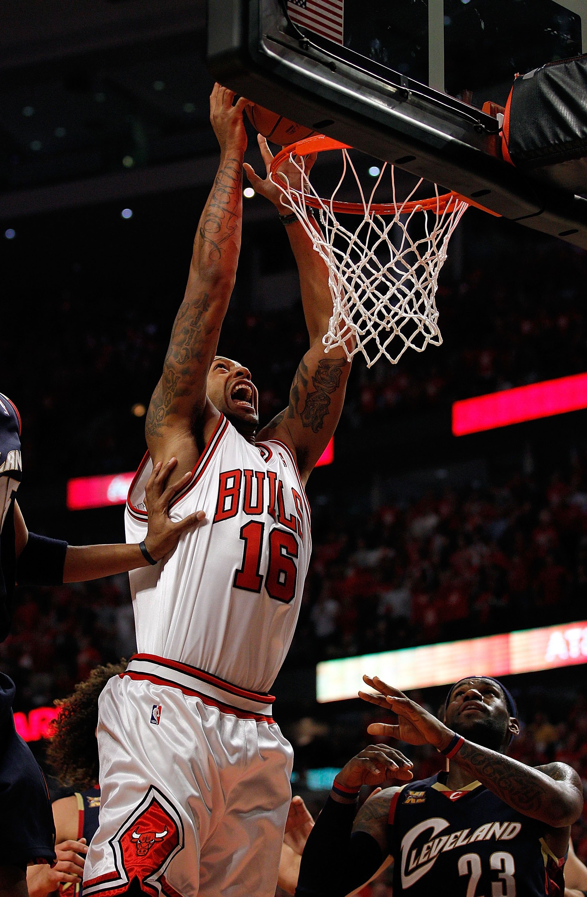 CHICAGO - APRIL 22: James Johnson #16 of the Chicago Bulls dunks the ball over LeBron James #23 of the Cleveland Cavaliers in Game Three of the Eastern Conference Quarterfinals during the 2010 NBA Playoffs at the United Center on April 22, 2010 in Chicago