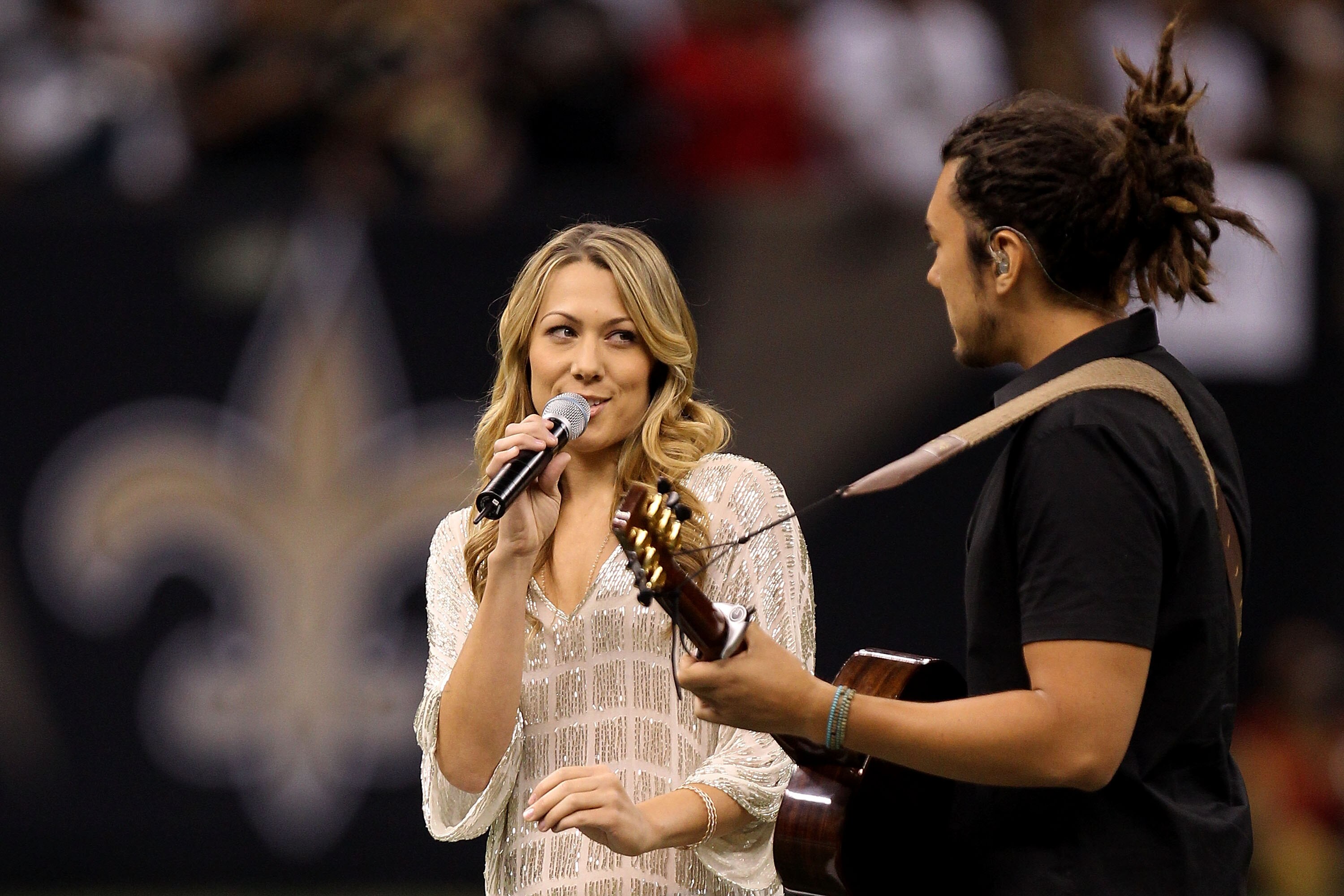 NEW ORLEANS - SEPTEMBER 09:  Singer Colbie Caillat performs the National Anthem prior to the New Orleans Saints playing against the Minnesota Vikings at Louisiana Superdome on September 9, 2010 in New Orleans, Louisiana.  (Photo by Ronald Martinez/Getty I