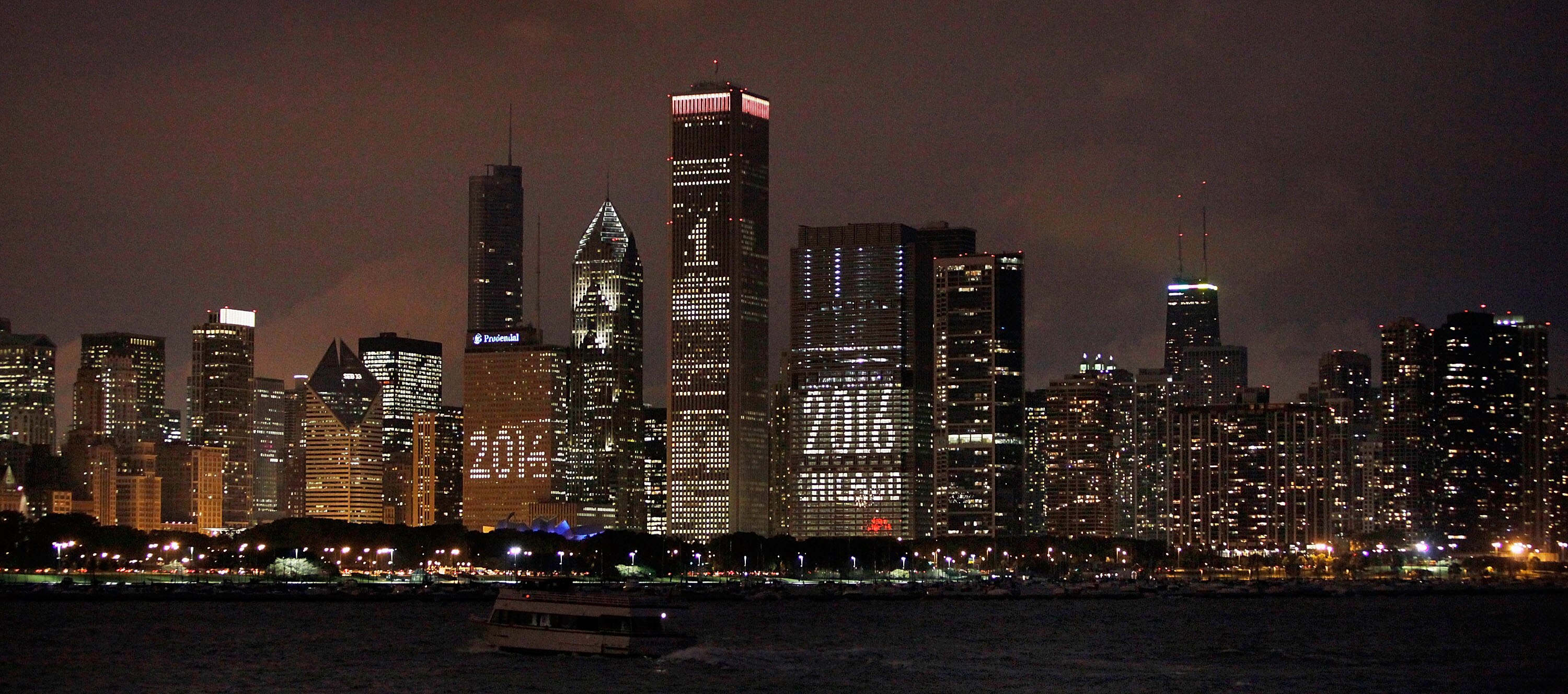 CHICAGO - OCTOBER 01:  The Chicago skyline is lit up with support for the city's bid to host the 2016 Olympics October 1, 2009 in Chicago, Illinois. The city is hosting a party in Daley Plaza tomorrow so residents can watch live as the International Olymp