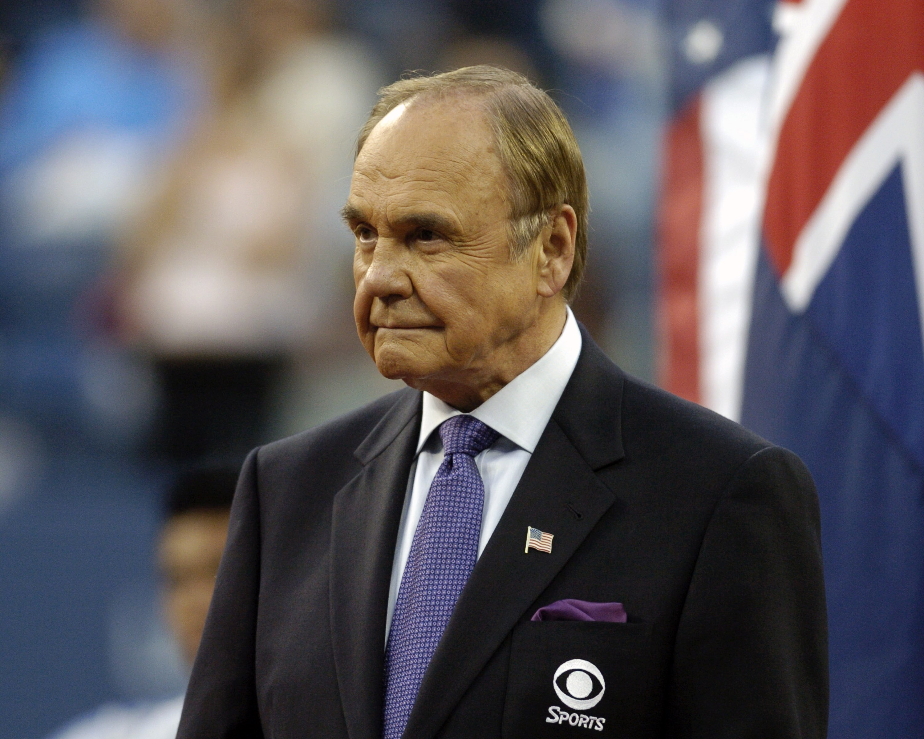 TV announcer Dick Enberg hosts the award ceremonies after  the men's singles final September 12, 2004  at the 2004 US Open in New York.  Roger Federer won the tournament. (Photo by A. Messerschmidt/Getty Images)