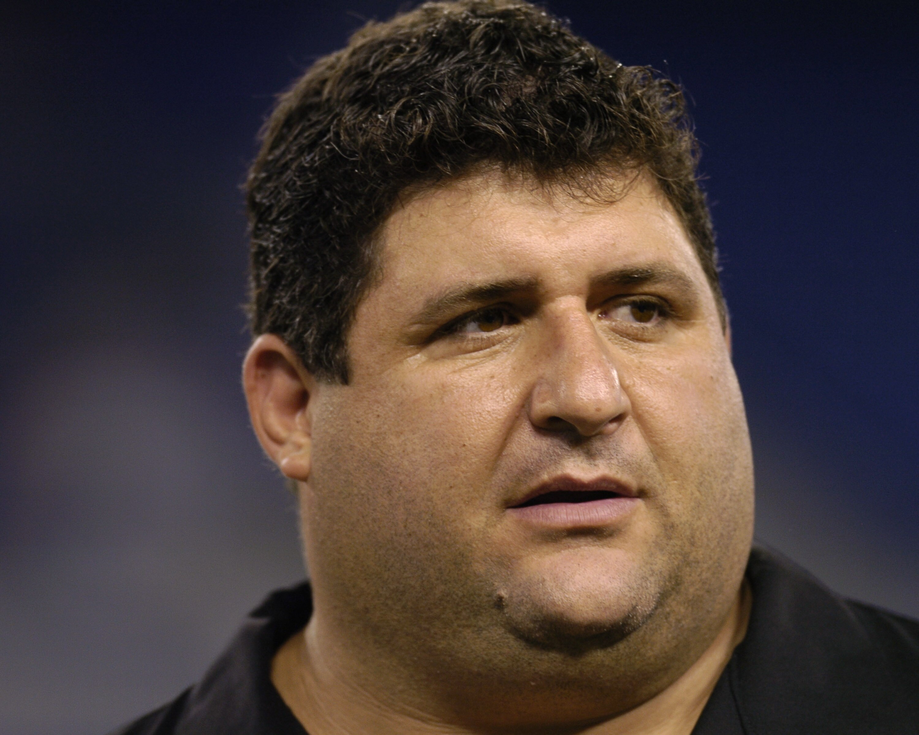 Former Baltimore Ravens nose tackle Tony Siragusa watches pregame warmups  October  4, 2004 on Monday Night Football at Baltimore, Maryland.  The 0 - 3 Kansas City  Chiefs defeated the Ravens 27 - 24.  (Photo by Al Messerschmidt/Getty Images)