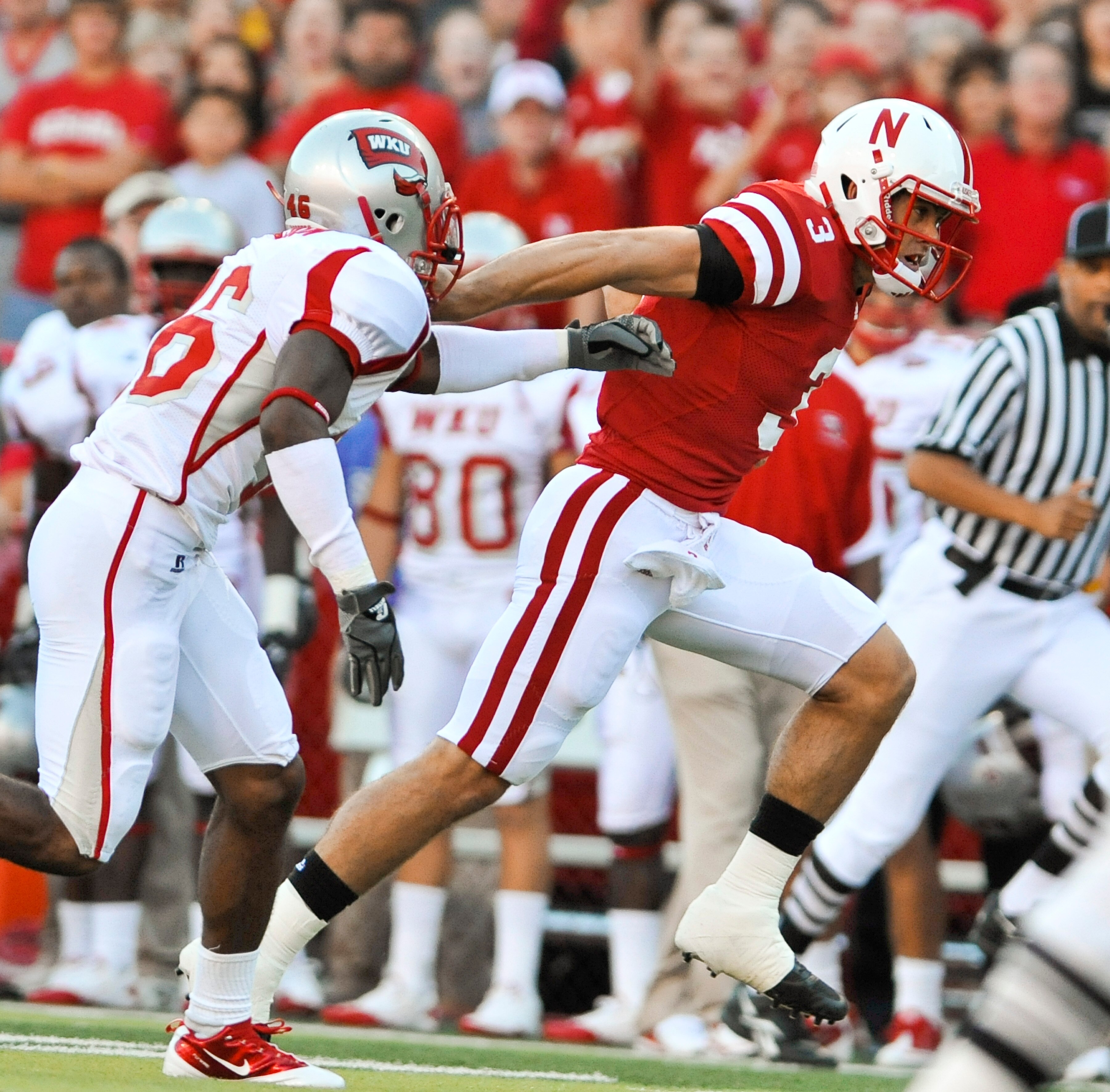LINCOLN, NE - SEPTEMBER 04:  Taylor Matinez  #3 of the Nebraska Cornhuskers scores his first touchdown as a Cornhusker during the first half of  their game against the Western Kentucky Hilltoppers at Memorial Stadium on September 4, 2010 in Lincoln, Nebra