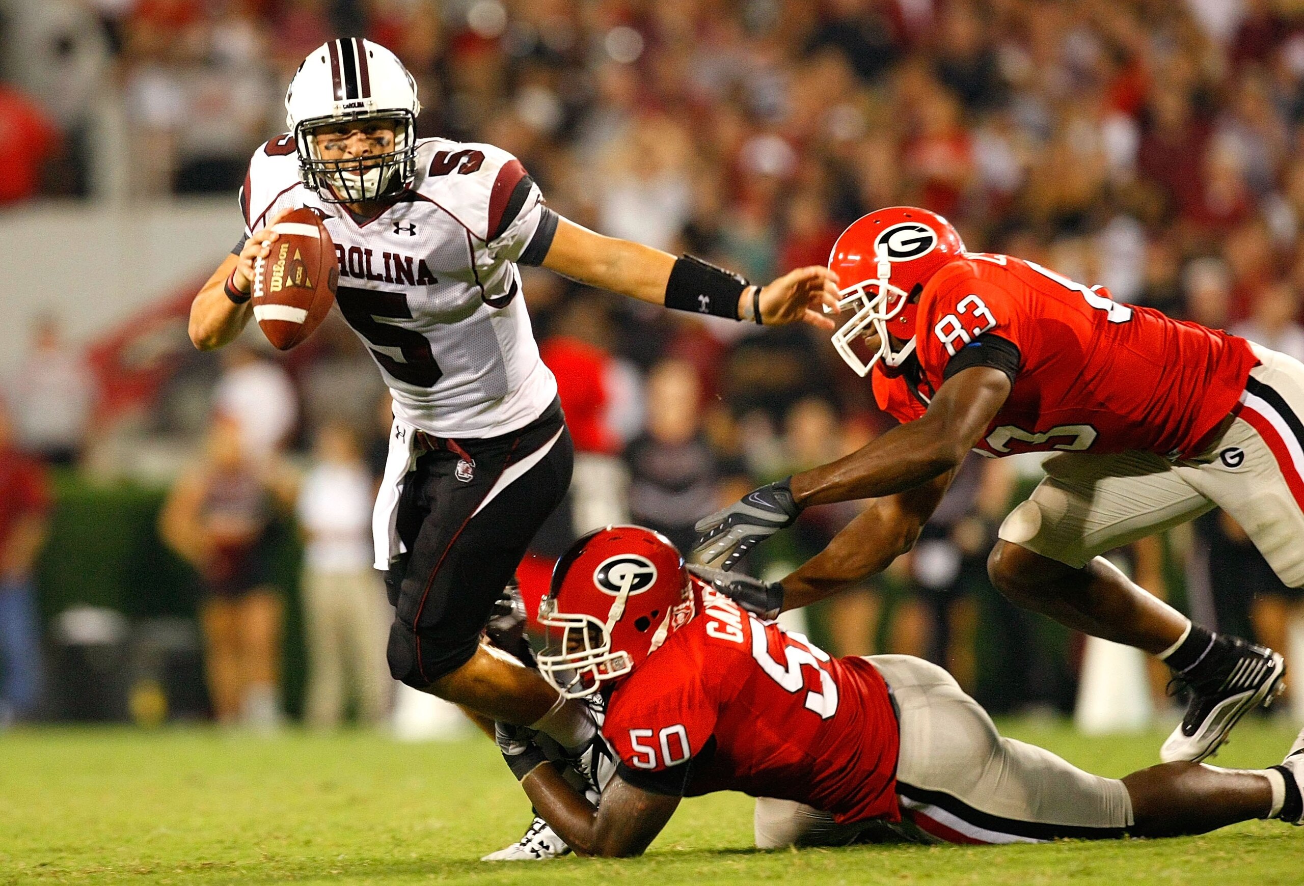 ATHENS, GA - SEPTEMBER 12:  Darryl Gamble #50 and Cornelius Washington #83 of the Georgia Bulldogs sack quarterback Stephen Garcia #5 of the South Carolina Gamecocks at Sanford Stadium on September 12, 2009 in Athens, Georgia.  (Photo by Kevin C. Cox/Gett